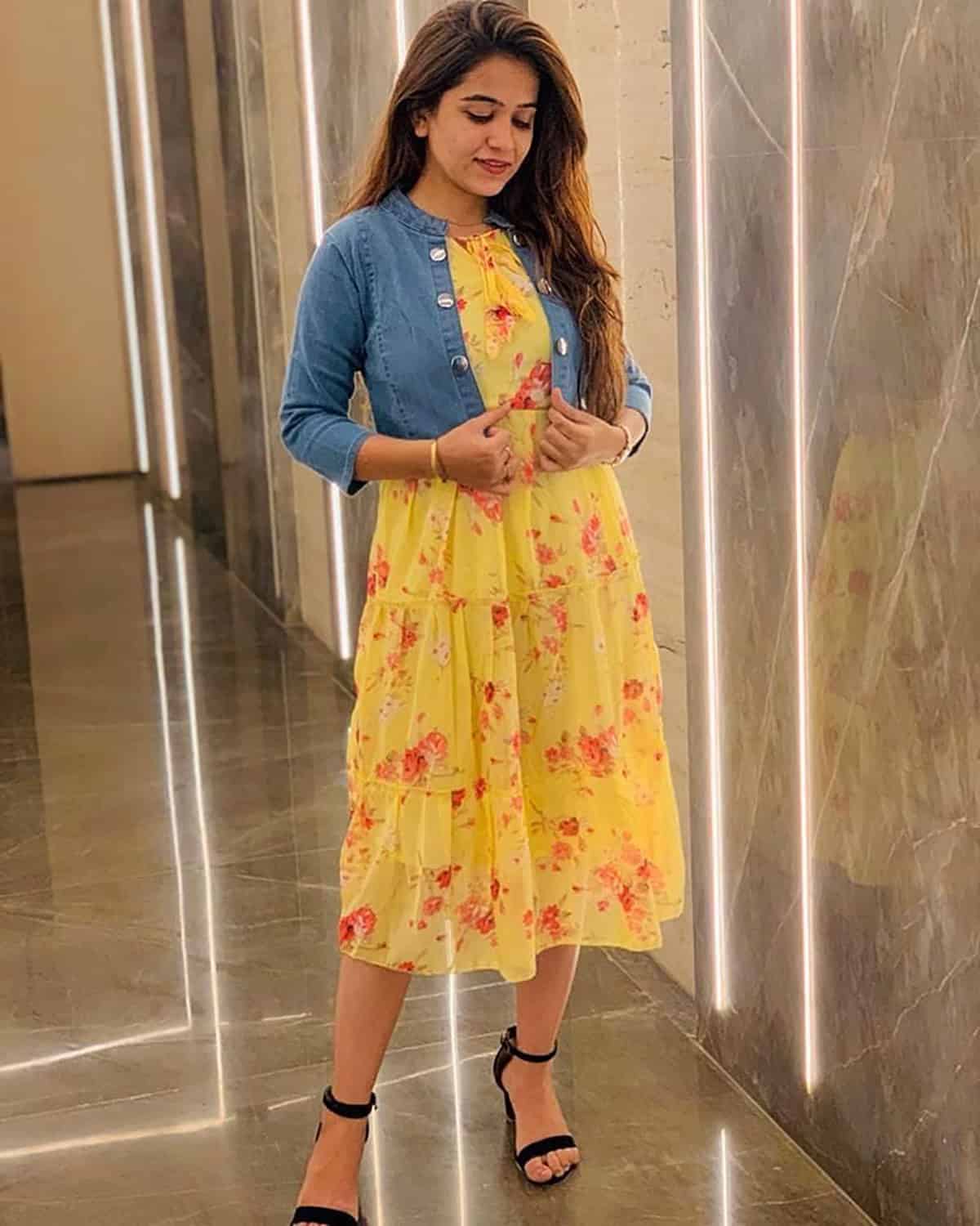 floral dress with light denim jacket and comfortable heels