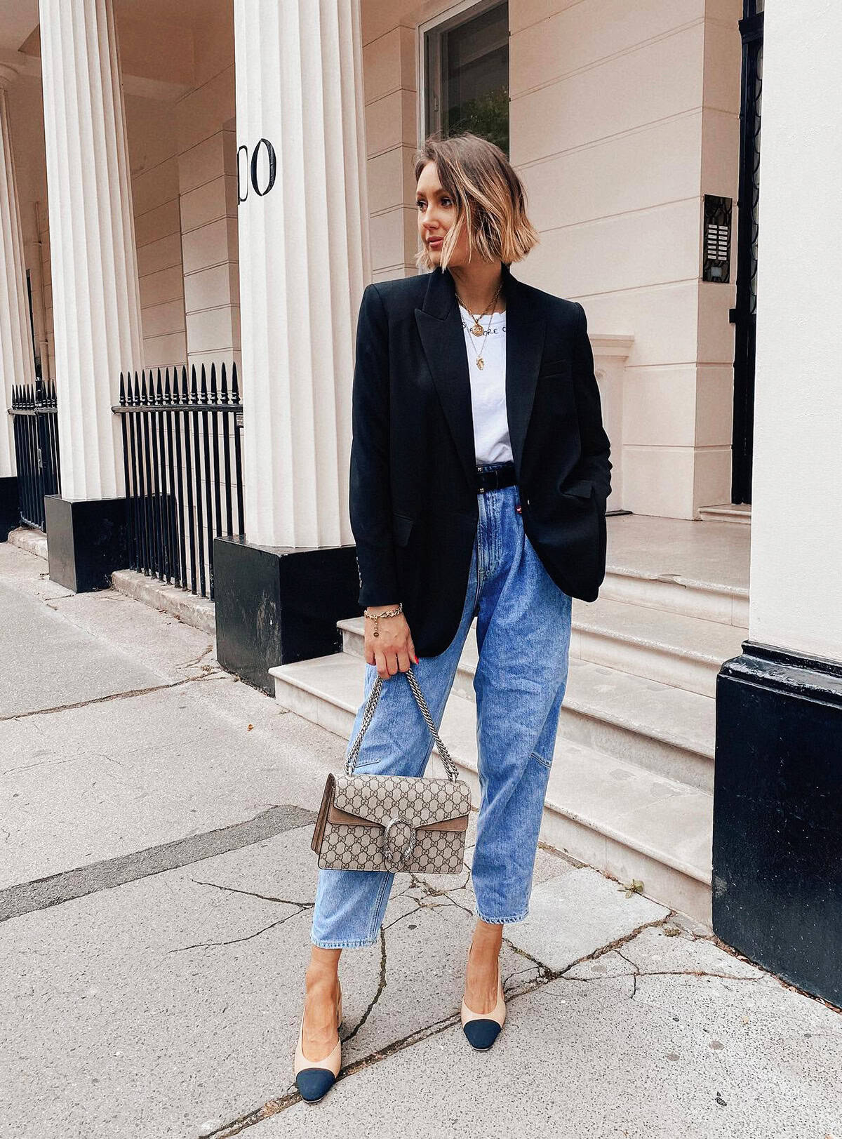 structured black blazer styled with a white tee and straight-leg jeans for a polished everyday outfit