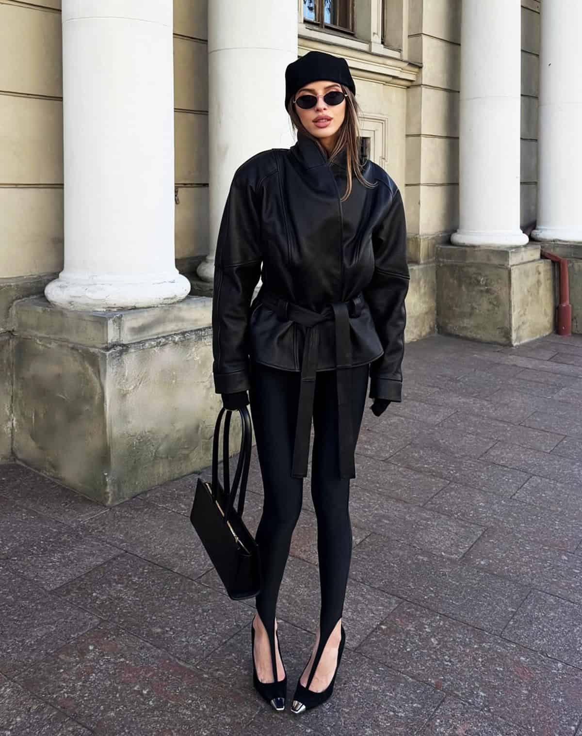 cute black leggings outfit for women styled with a belted leather jacket and heels, cute outfits with leggings for women over 30
