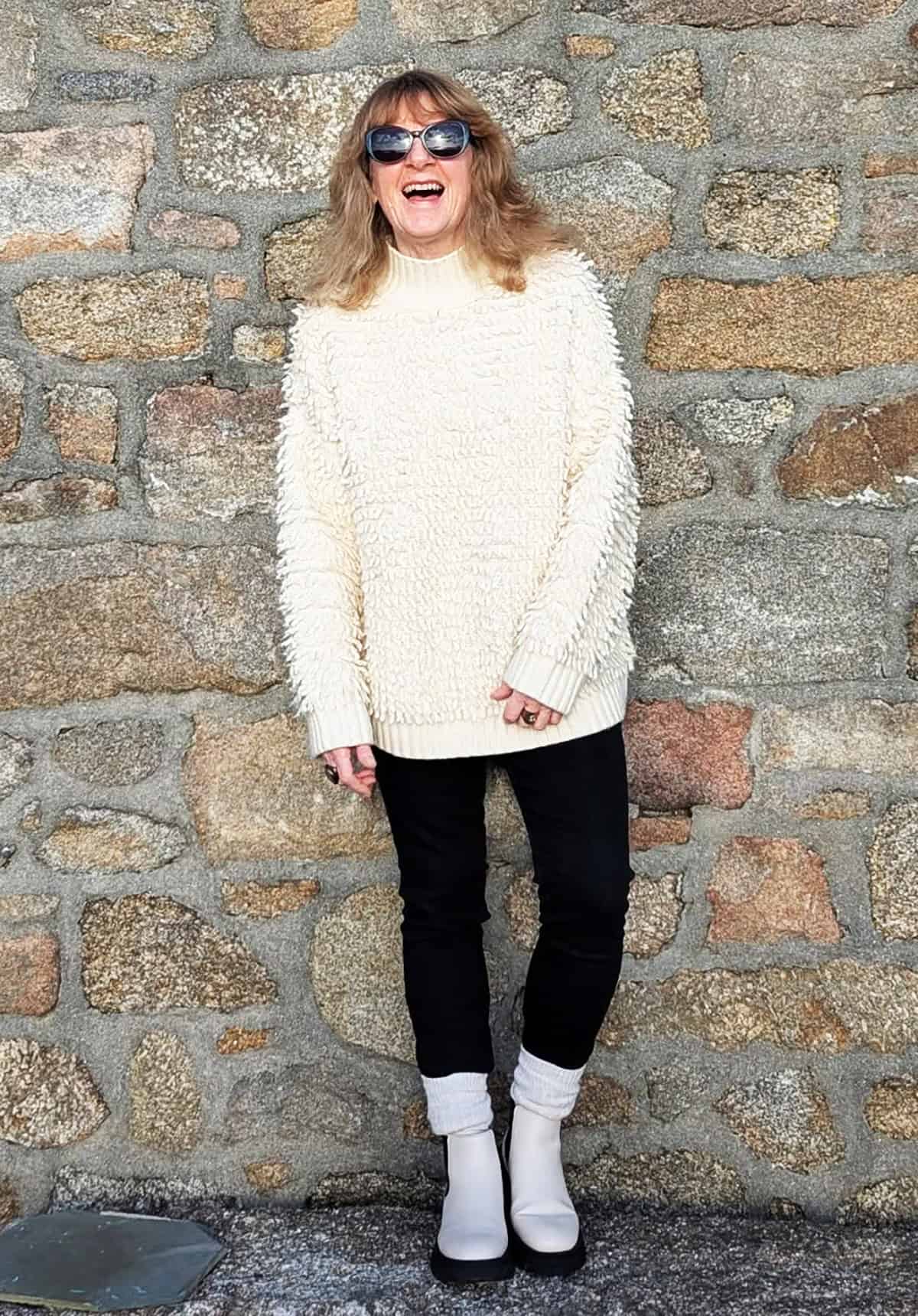 cute cozy sweater outfit with black leggings and ankle boots for women over 30