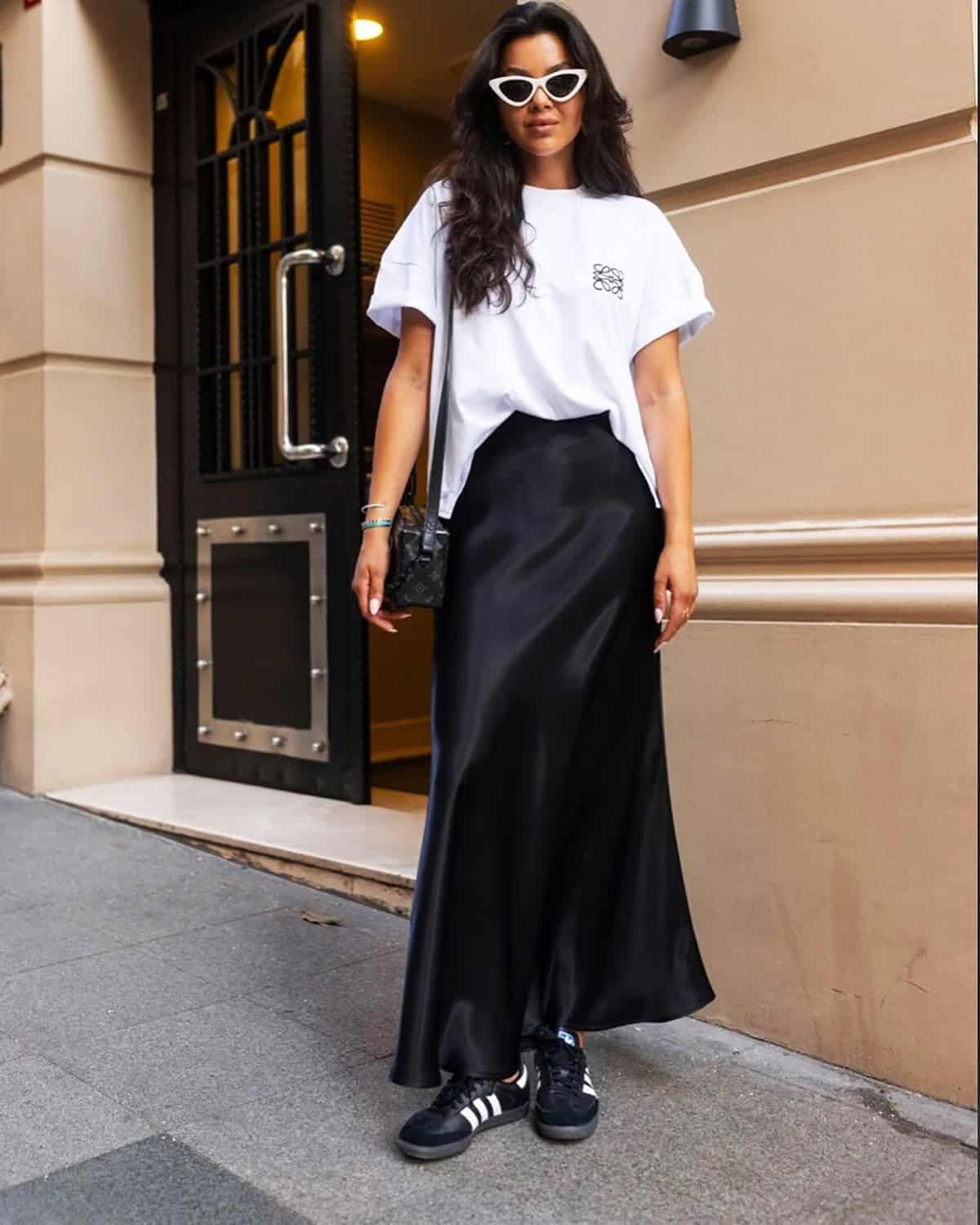 black satin skirt styled for a budget cocktail dress code outfit