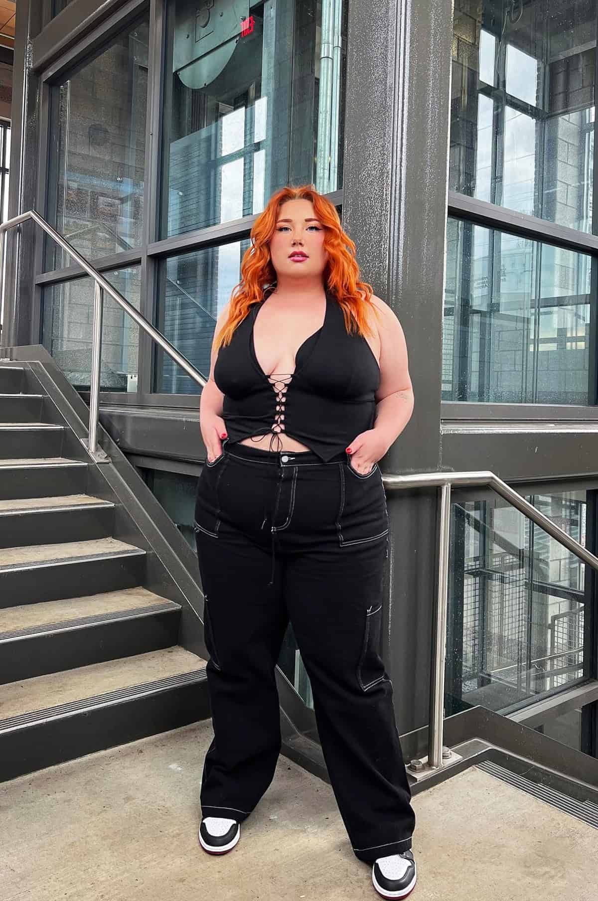 Lace-up halter top and black cargo pants for festival outfits for plus size women