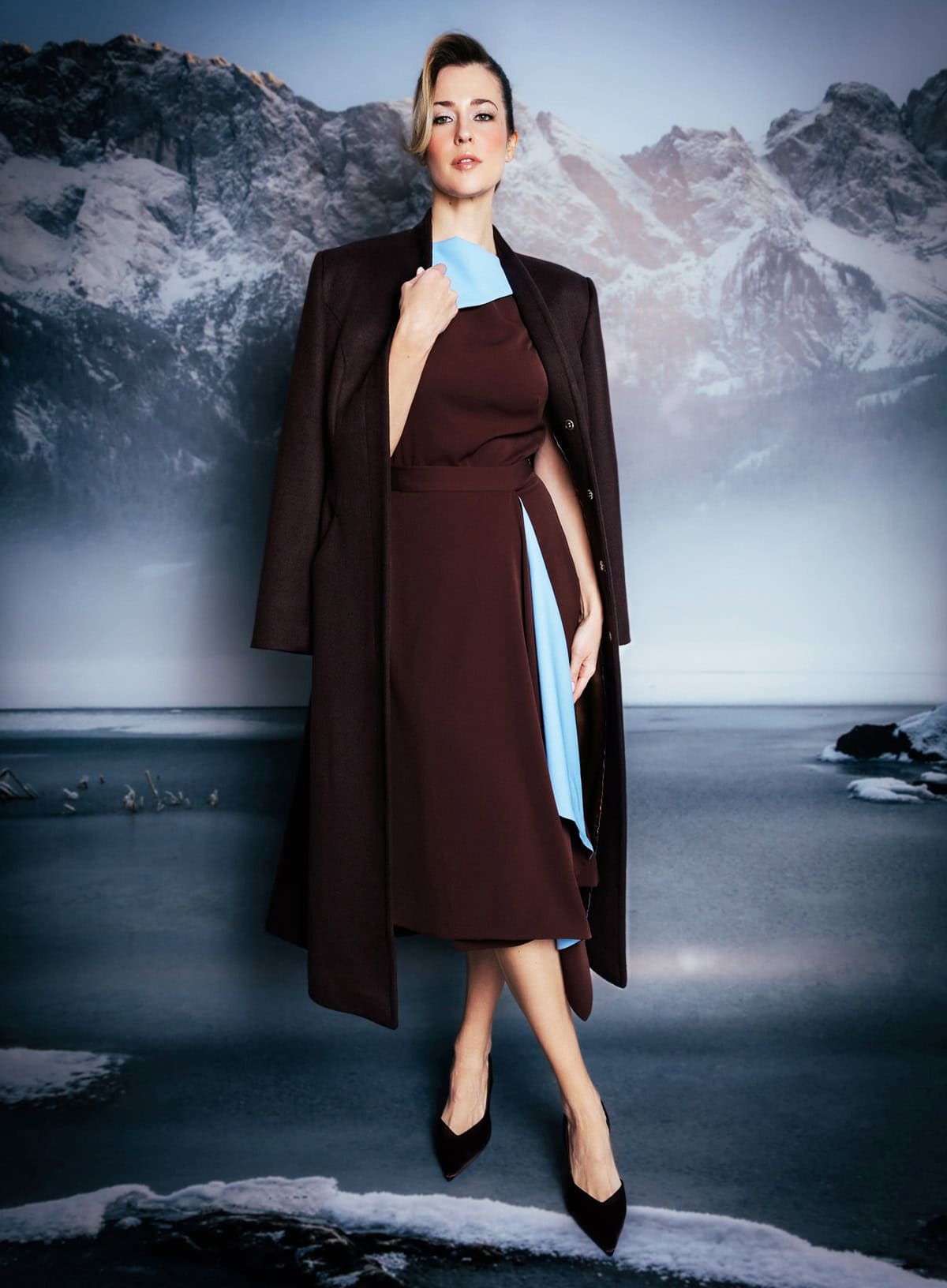long tailored coat layered over a cocktail dress for an elegant winter cocktail outfit