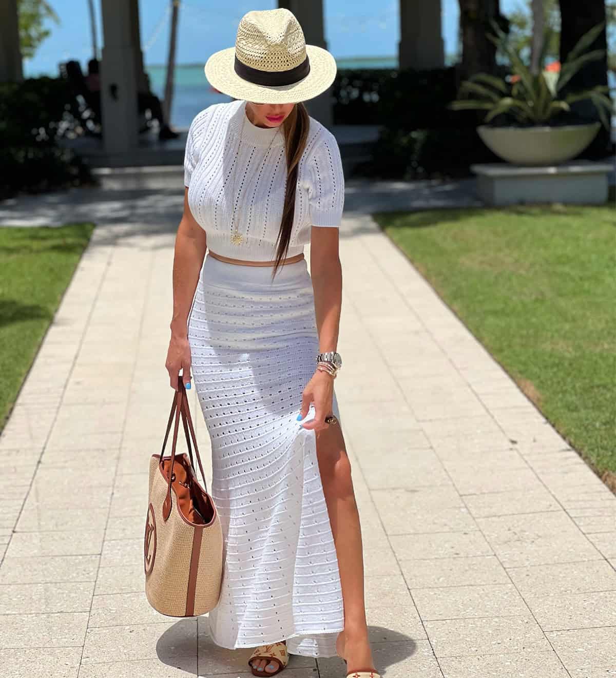 white knit skirt set with straw hat for a chic Cancun resort outfit