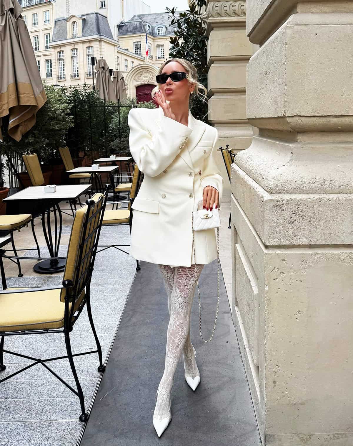 white blazer dress with lace tights and pointed heels styled for a winter cocktail outfit