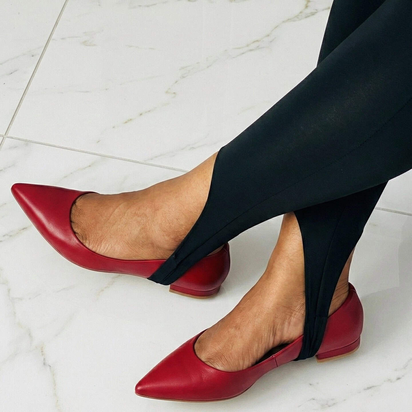 black stirrup leggings with red shoes