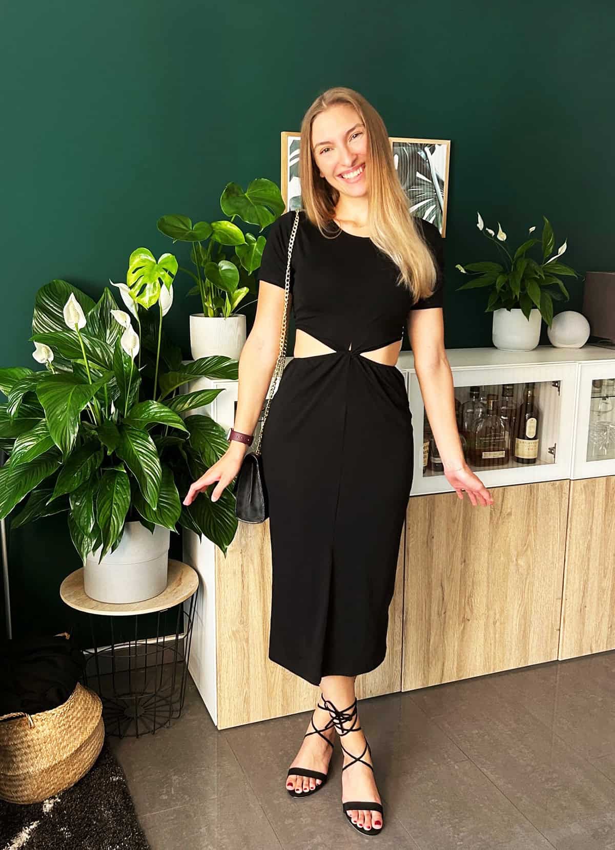 black midi cocktail dress with waist cutout styled for cocktail dress code for women