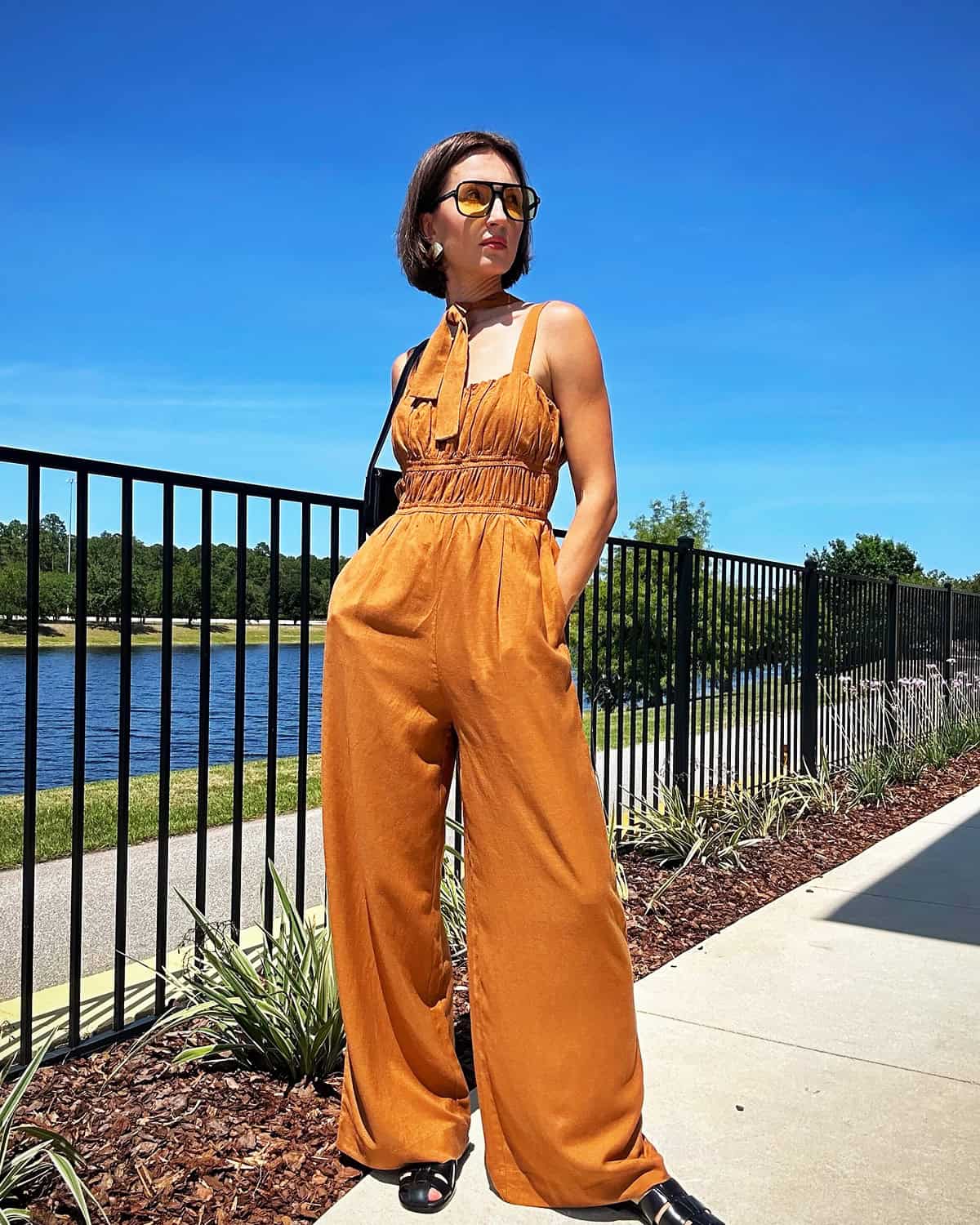 rust wide leg jumpsuit outfit for a budget cocktail dress code event