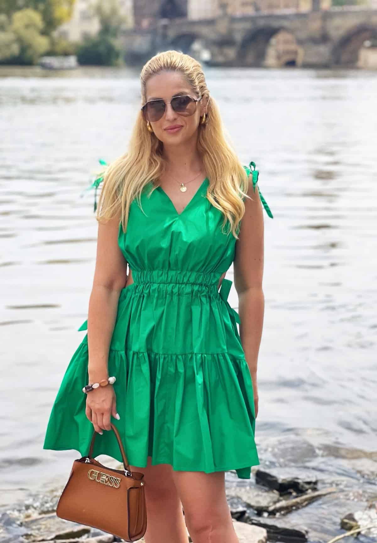 woman in green outdoors graduation dress