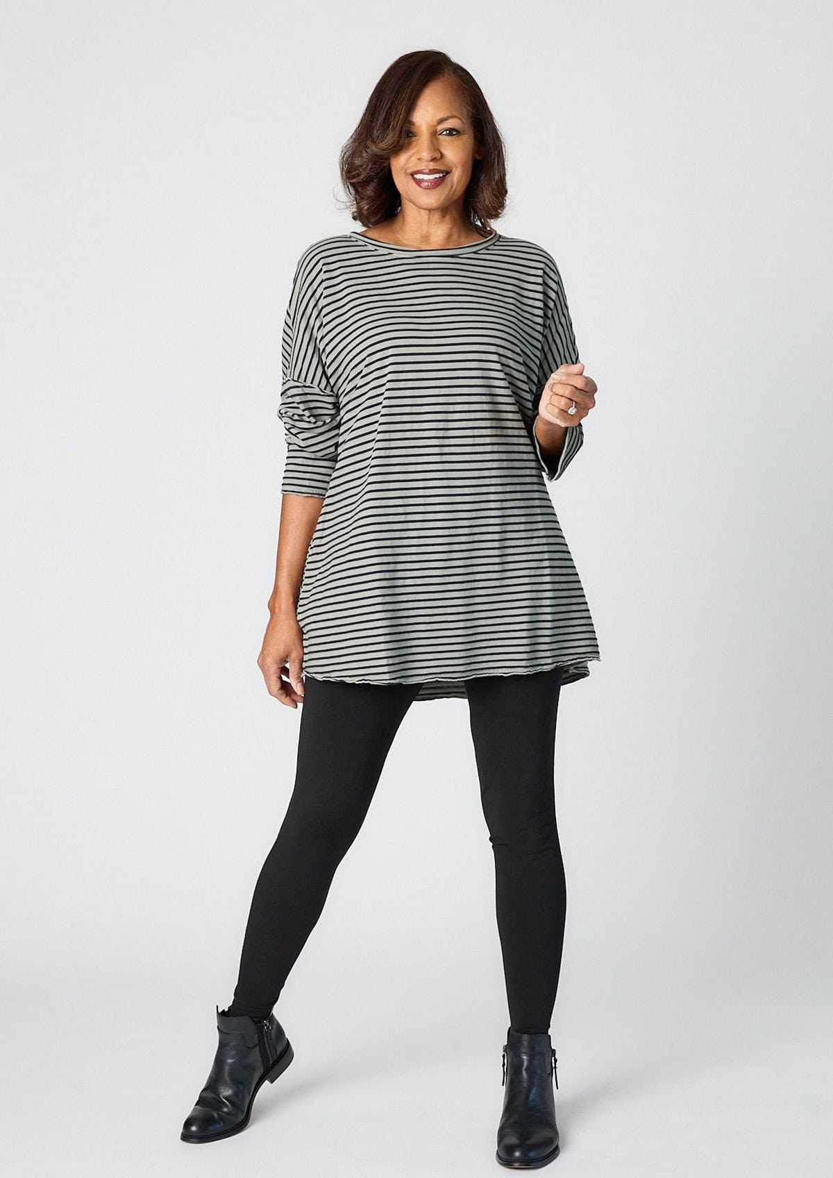 cute tunic and leggings outfit for women styled with ankle boots