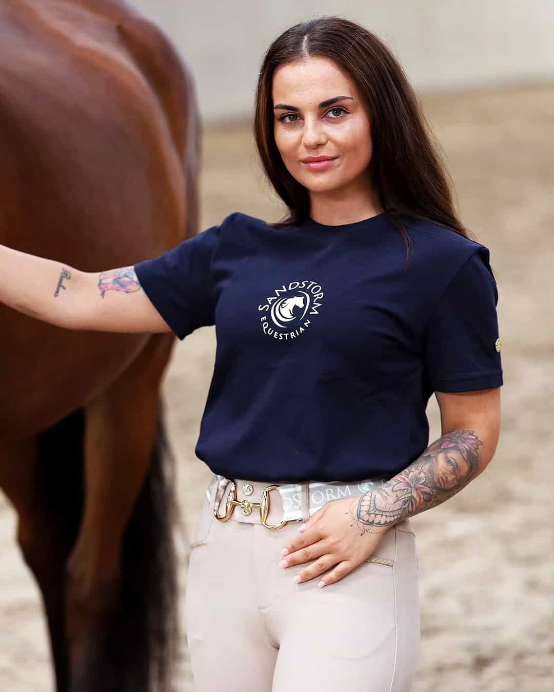 dark tee and beige breeches equestrian outfit