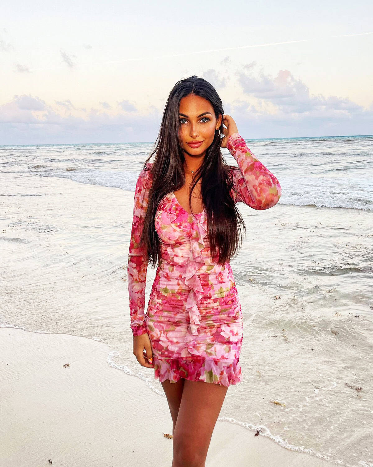 pink floral long sleeve beach mini dress for a Cancun vacation outfit
