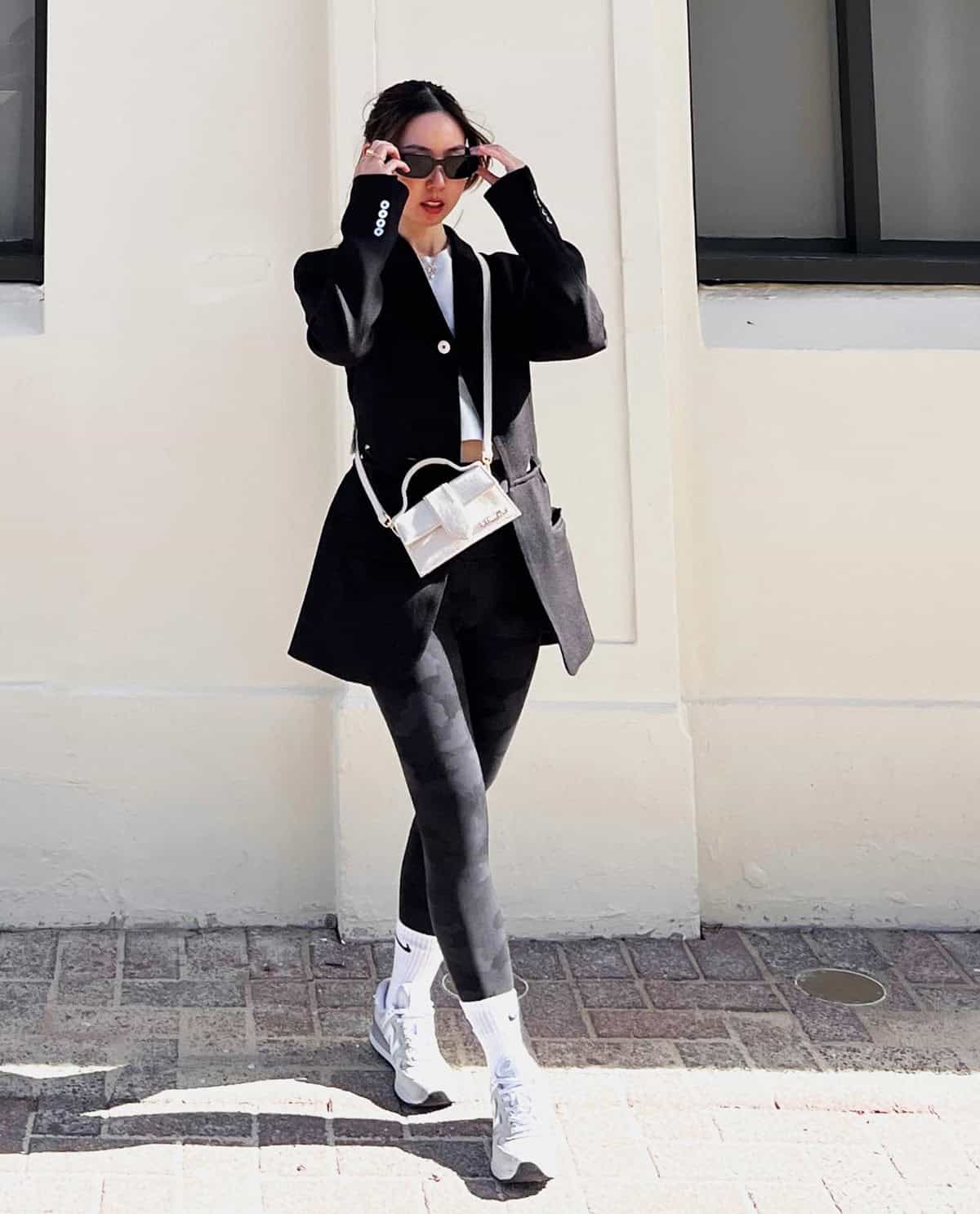cute sporty leggings outfit for women styled with a blazer and white sneakers
