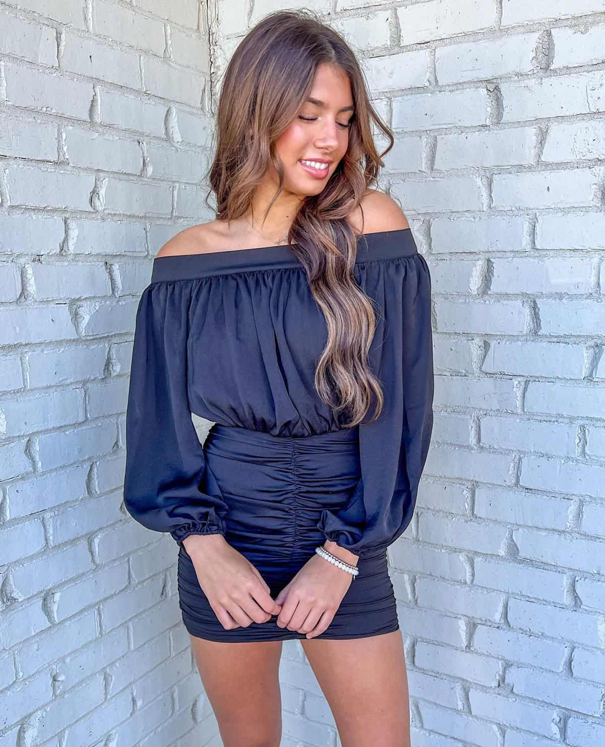 black off shoulder top and skirt outfit for a cocktail dress code event on a budget