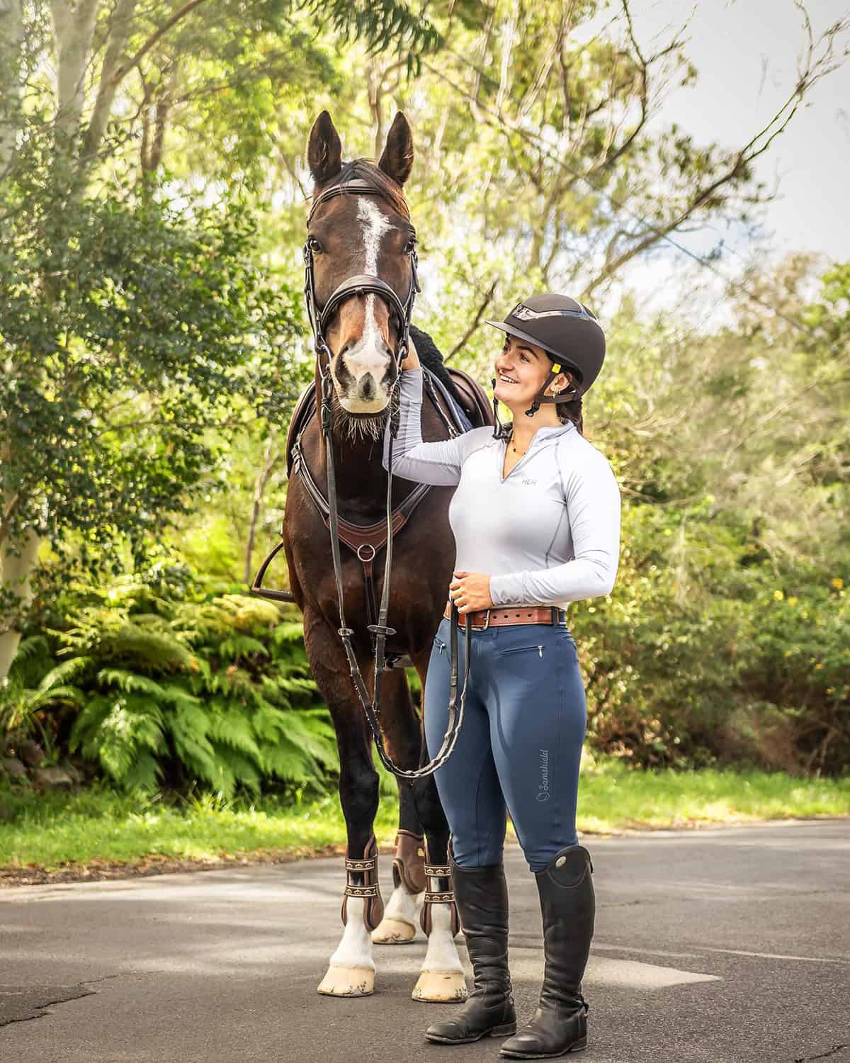 grey top and blue breeches clean equestrian outfit on a budget