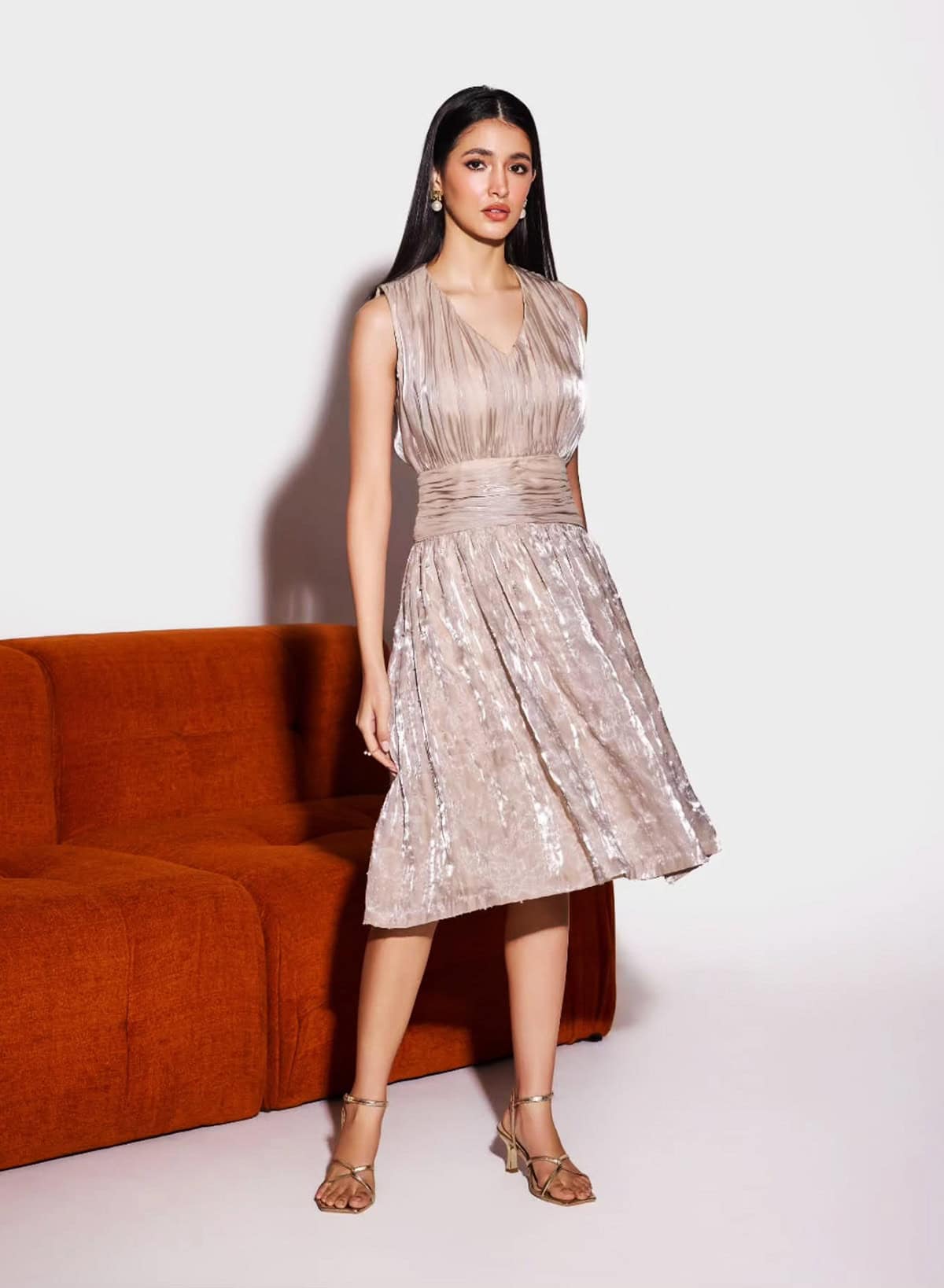 champagne midi cocktail dress with pleated skirt styled for cocktail dress code for women
