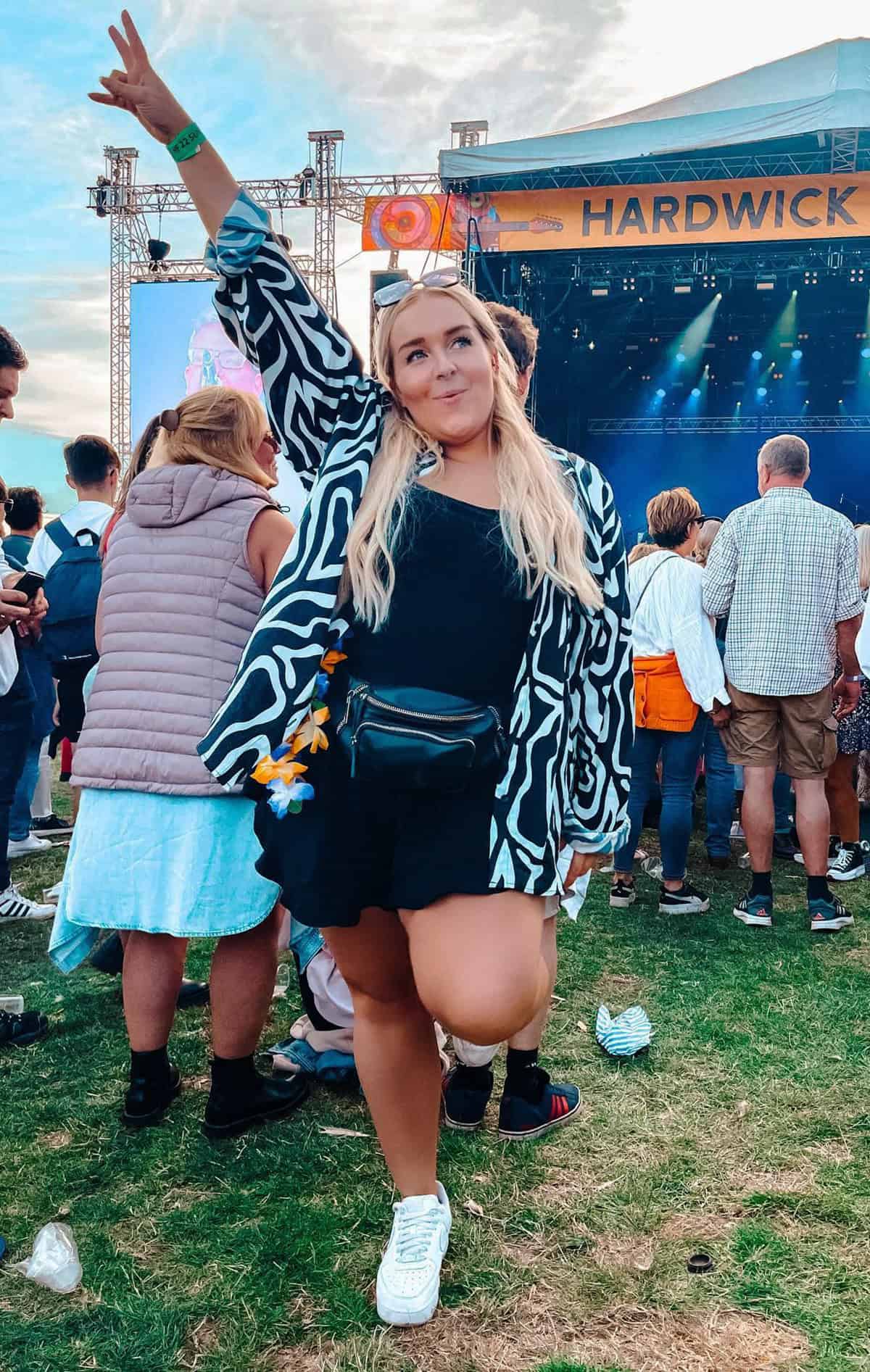 zebra print kimono and black mini skirt with belt bag for festival outfits for plus size women