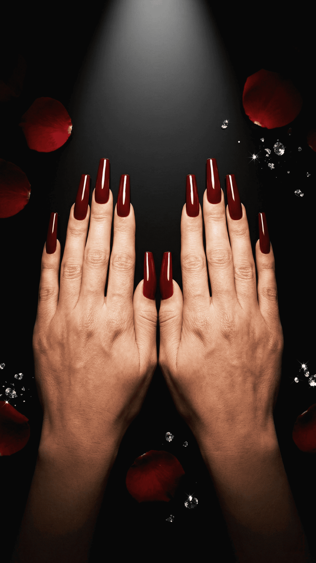 coffin shaped dark red baddie nails, black background