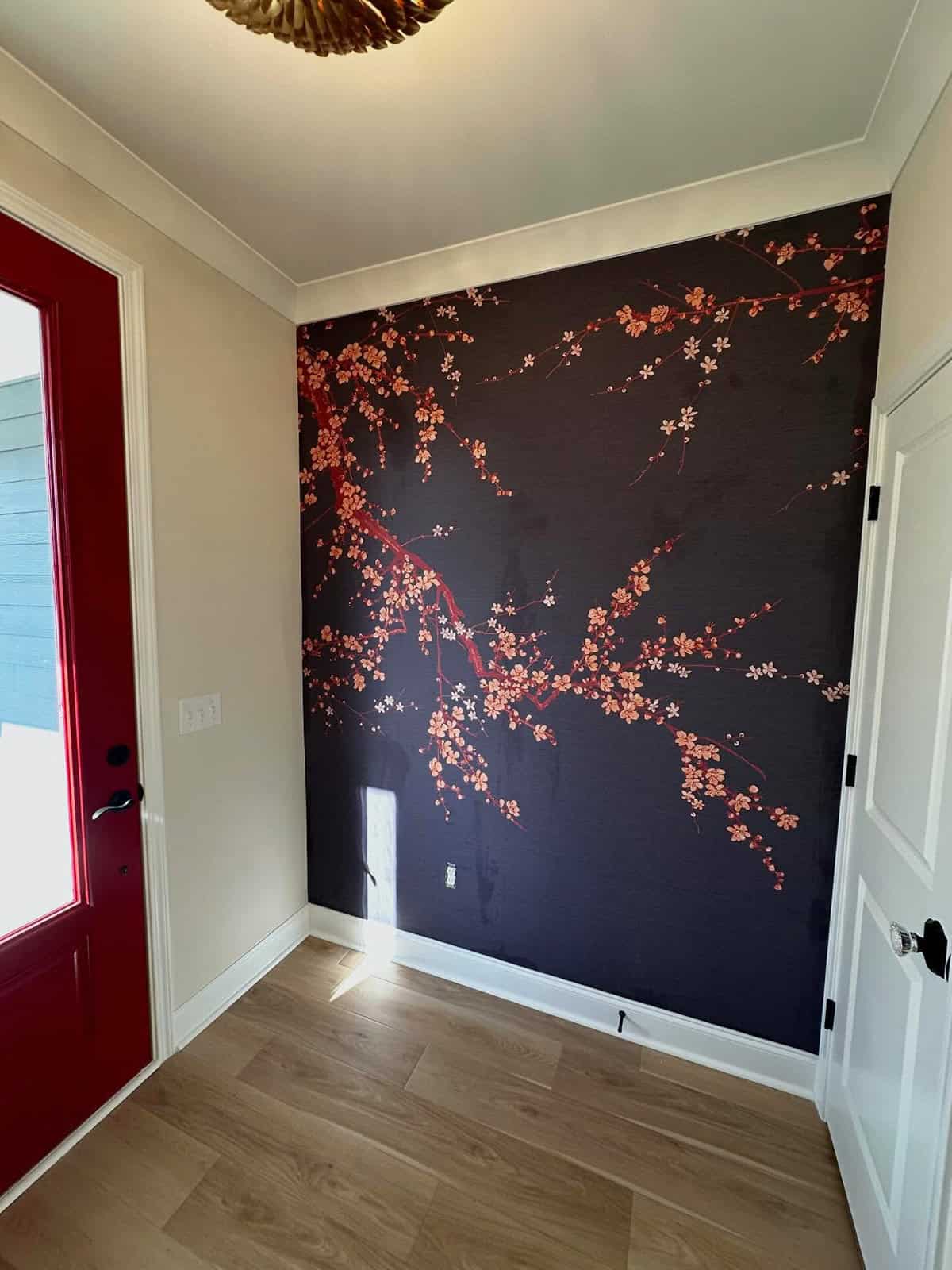 : entryway with black wallpaper and delicate branch design with light walls black wallpaper ideas home decor