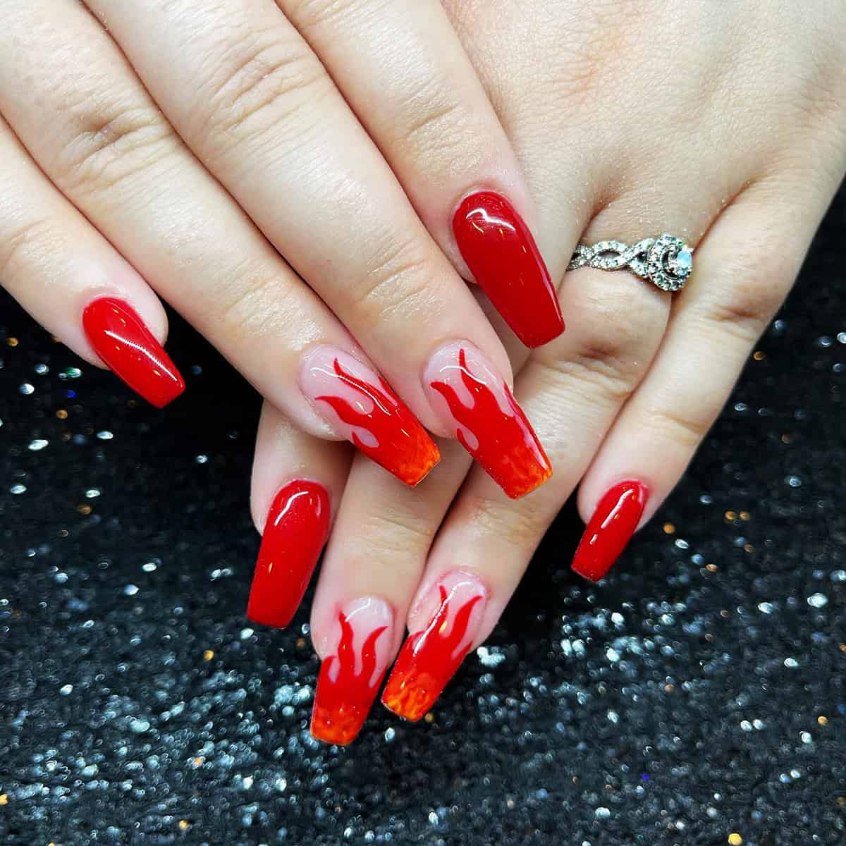 long red coffin nails with sheer flame accent nails and orange gradient fire nails