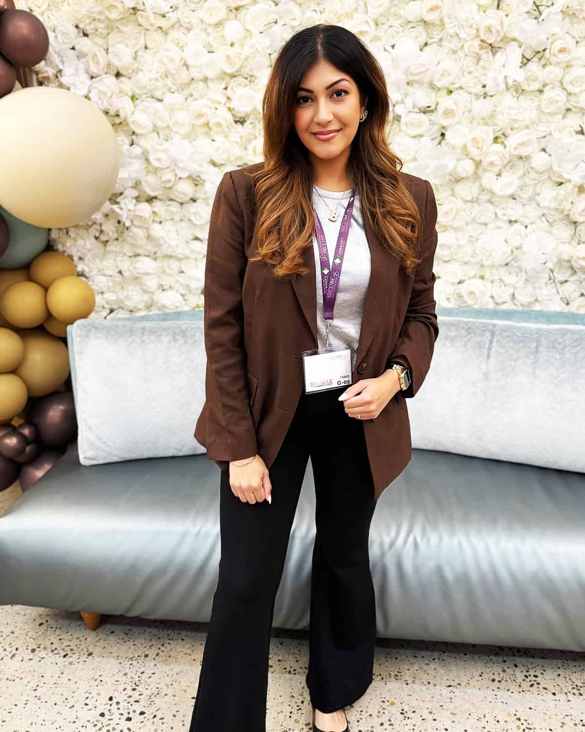 brown blazer over grey tee with black wide-leg trousers and black flats for office attire for women over 40