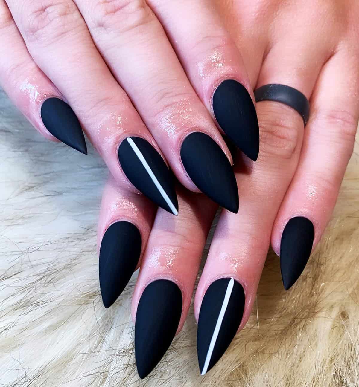 matte black stiletto nails with sharp white line accent design black baddie nails