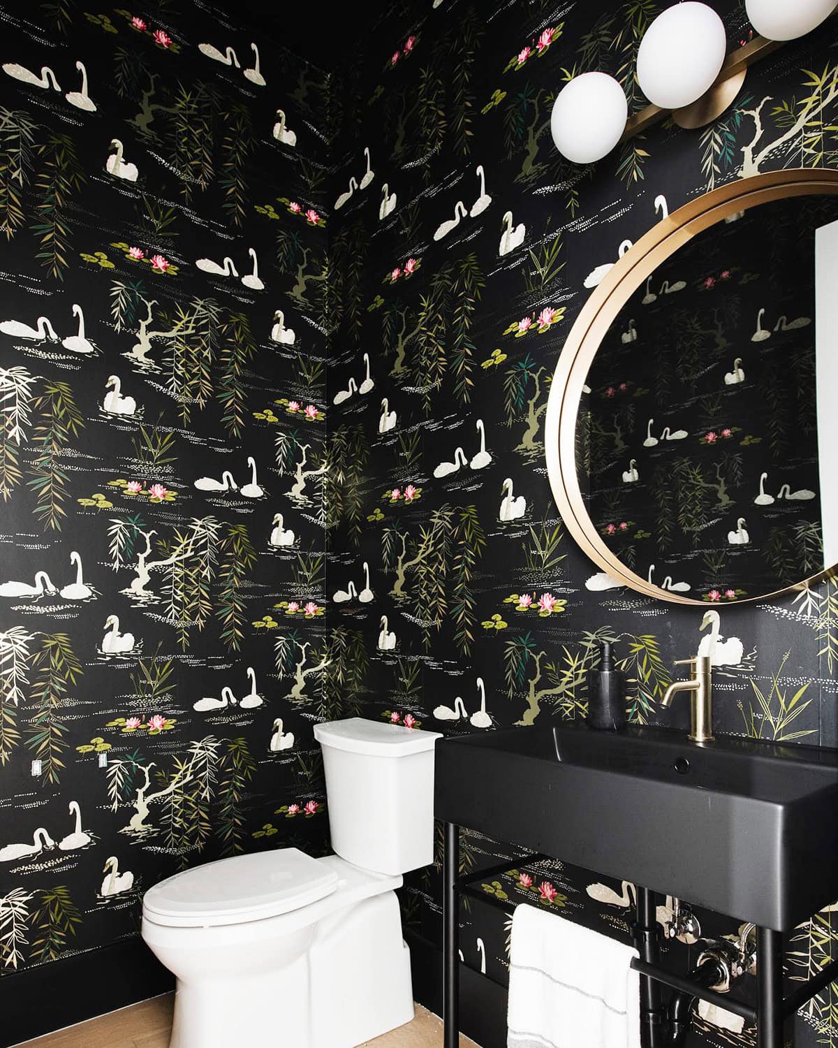 small bathroom with black swan patterned wallpaper and gold accents black wallpaper ideas home decor