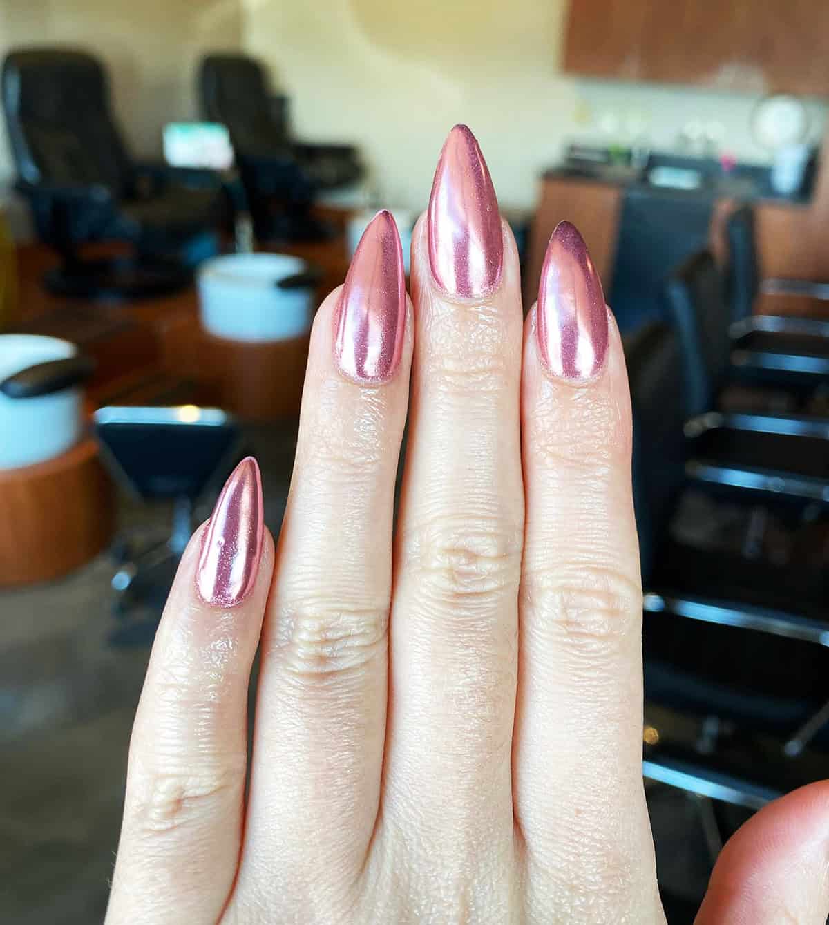 full mirror pink chrome almond nails highly reflective metallic finish pink chrome nails