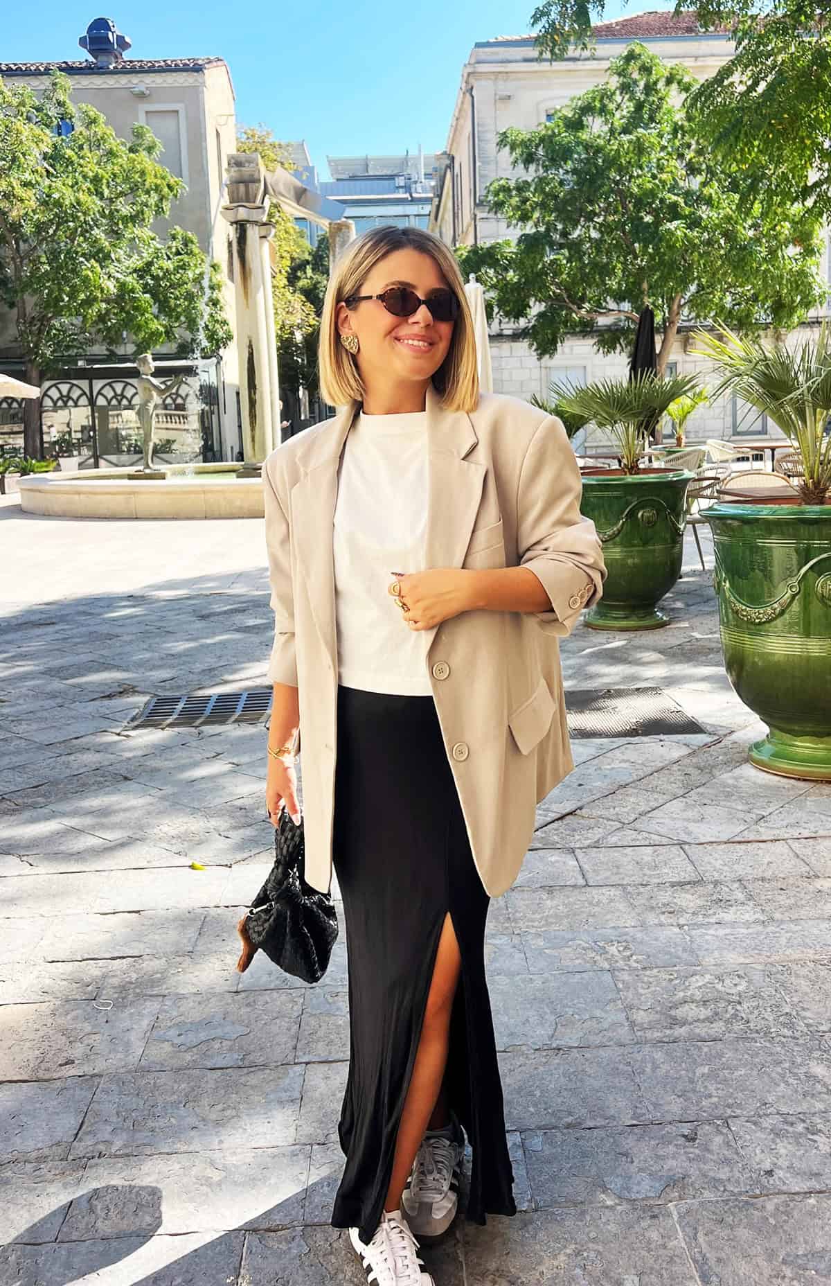 beige oversized blazer over white tee with black maxi skirt and white sneakers for office attire for women over 40