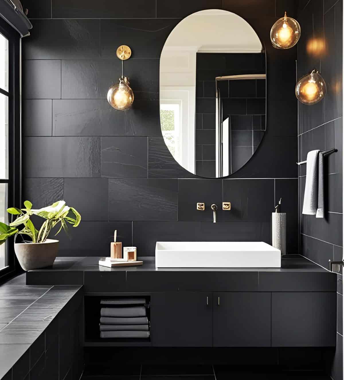 large format black wall tiles with matte finish and gold fixtures modern bathroom design black bathroom ideas