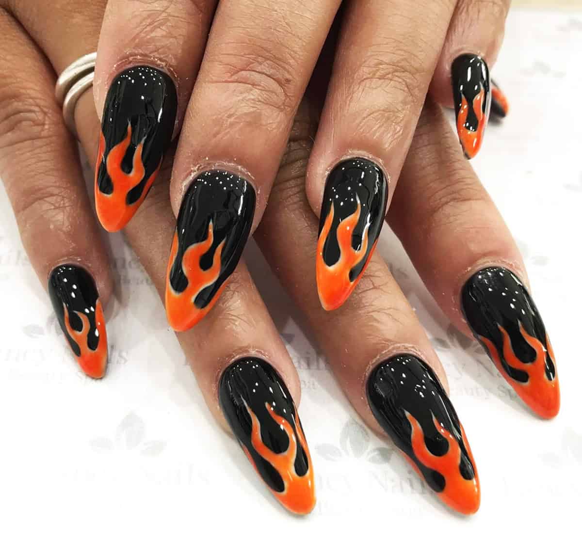 black stiletto nails with bright orange flame nail art fire nails