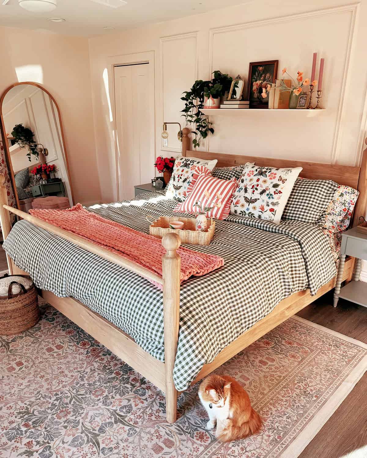 gingham bedding with floral pillows and pink throw, bright and airy cottage bedroom cottagecore bedroom insp