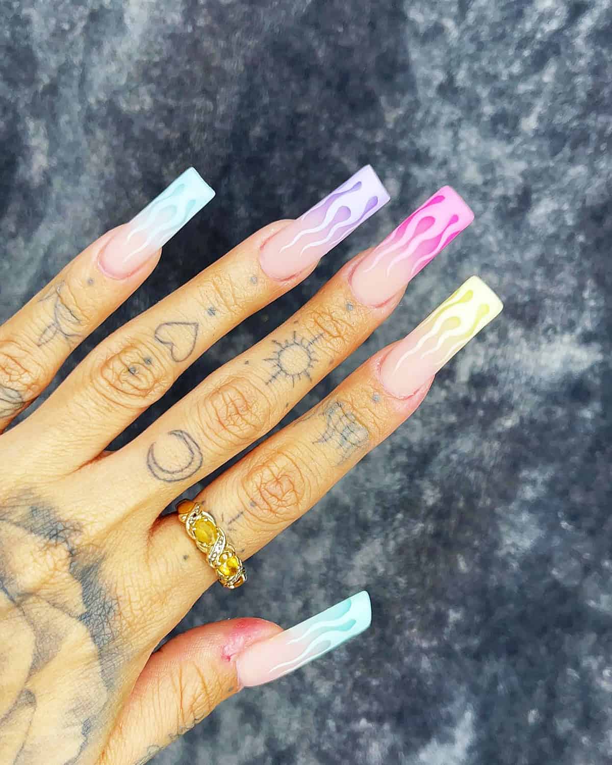 long coffin nails with pastel multicolor flame tips on each nail fire nails