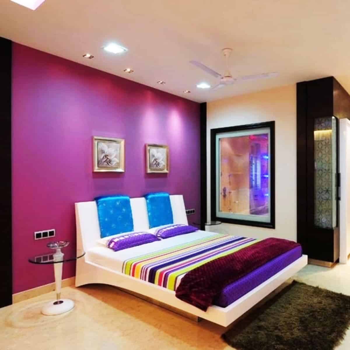 deep magenta painted accent wall in a bold bedroom with white platform bed pink wallpaper ideas home decor