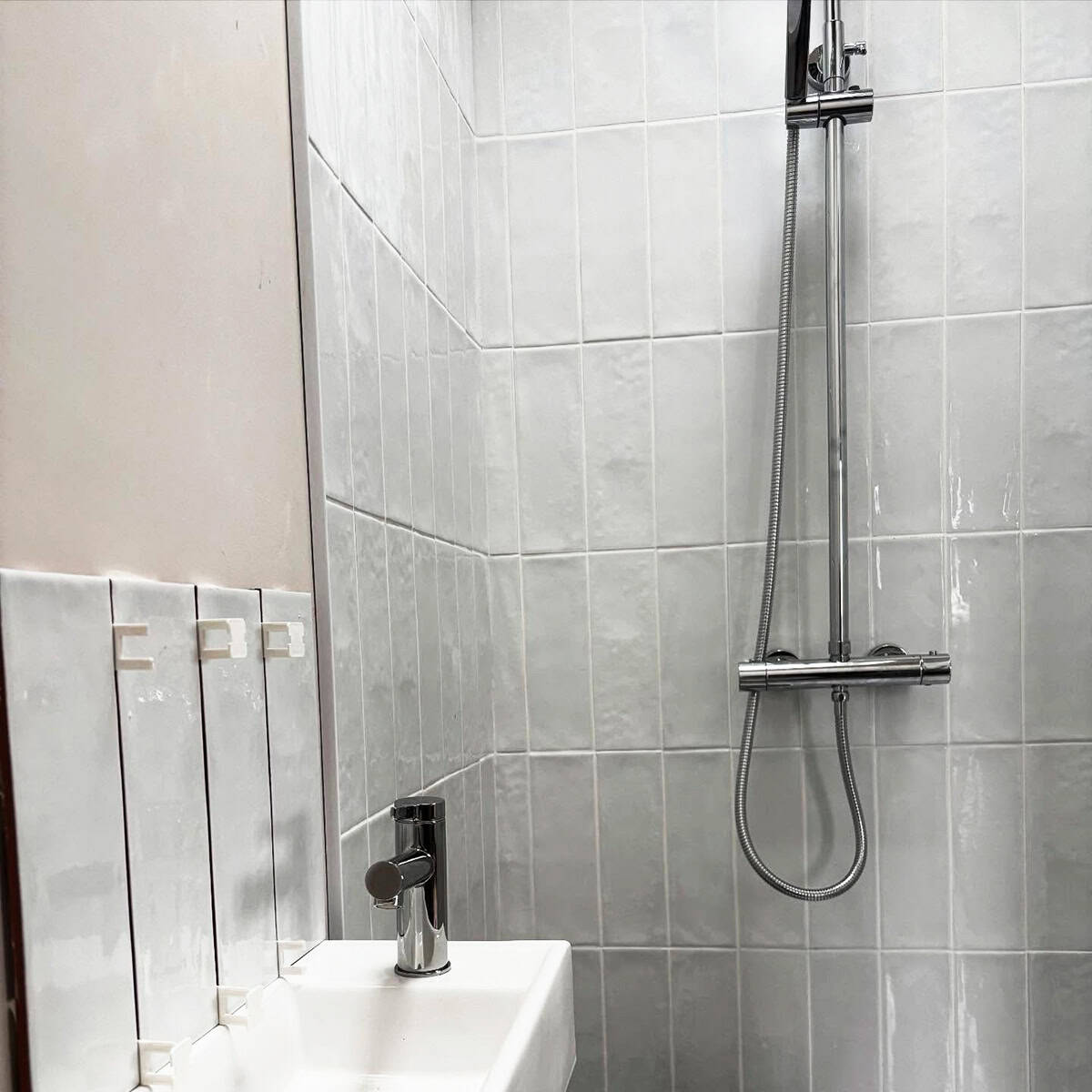 vertical white glossy subway tile bathroom tile ideas ideas