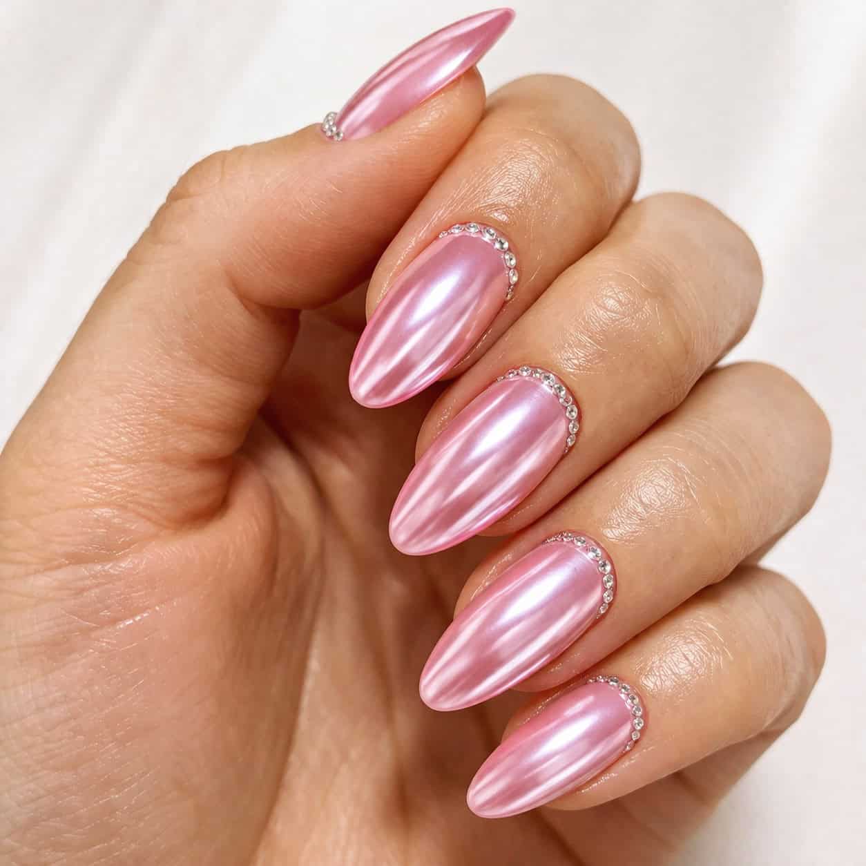 pink chrome nails with rhinestones