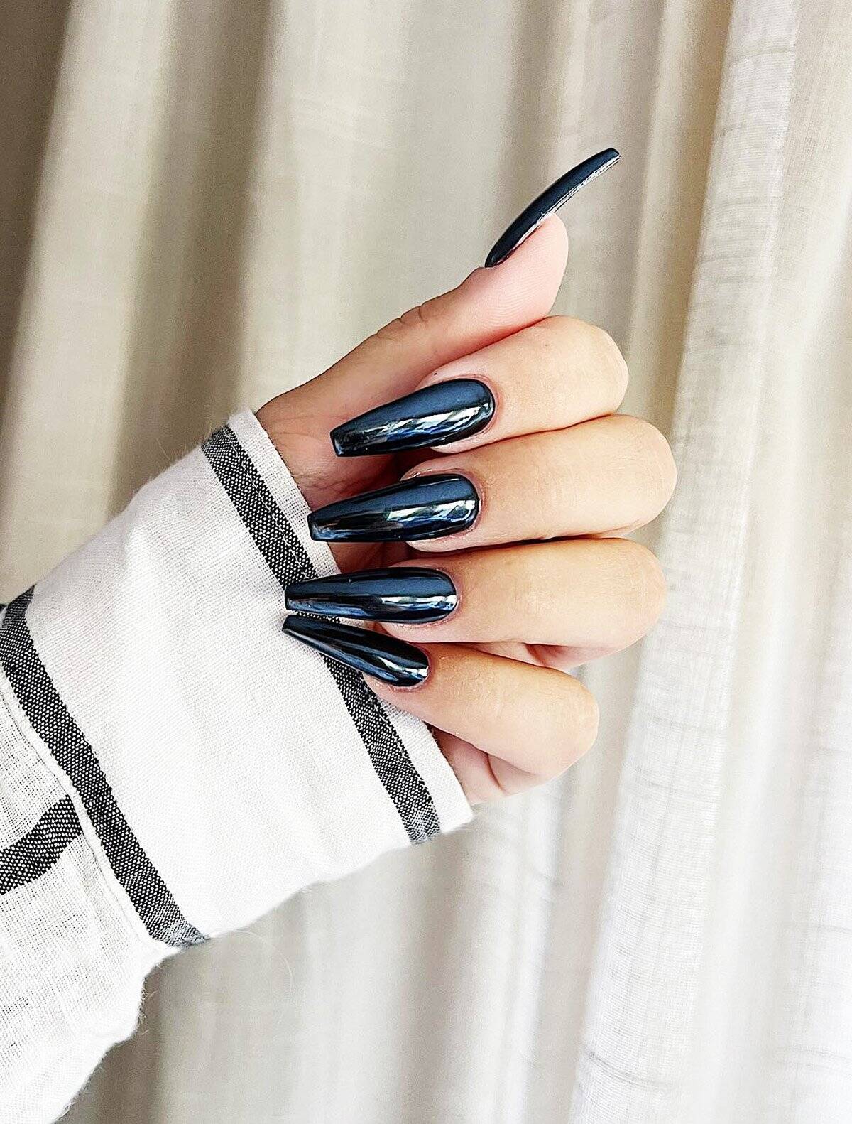 long coffin nails with ultra glossy black mirror finish, glam and bold black baddie nails