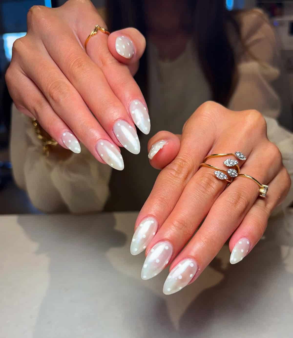 almond nails with milky white chrome and polka dot design white chrome nails