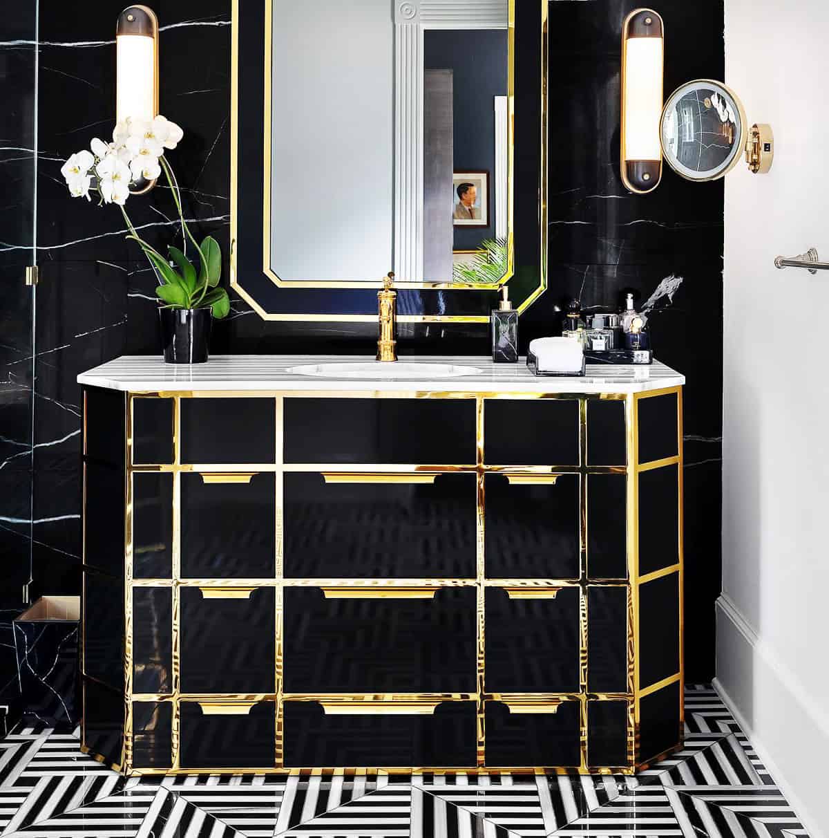black veined wall bathroom with gold fixtures and mirror lighting black bathroom ideas