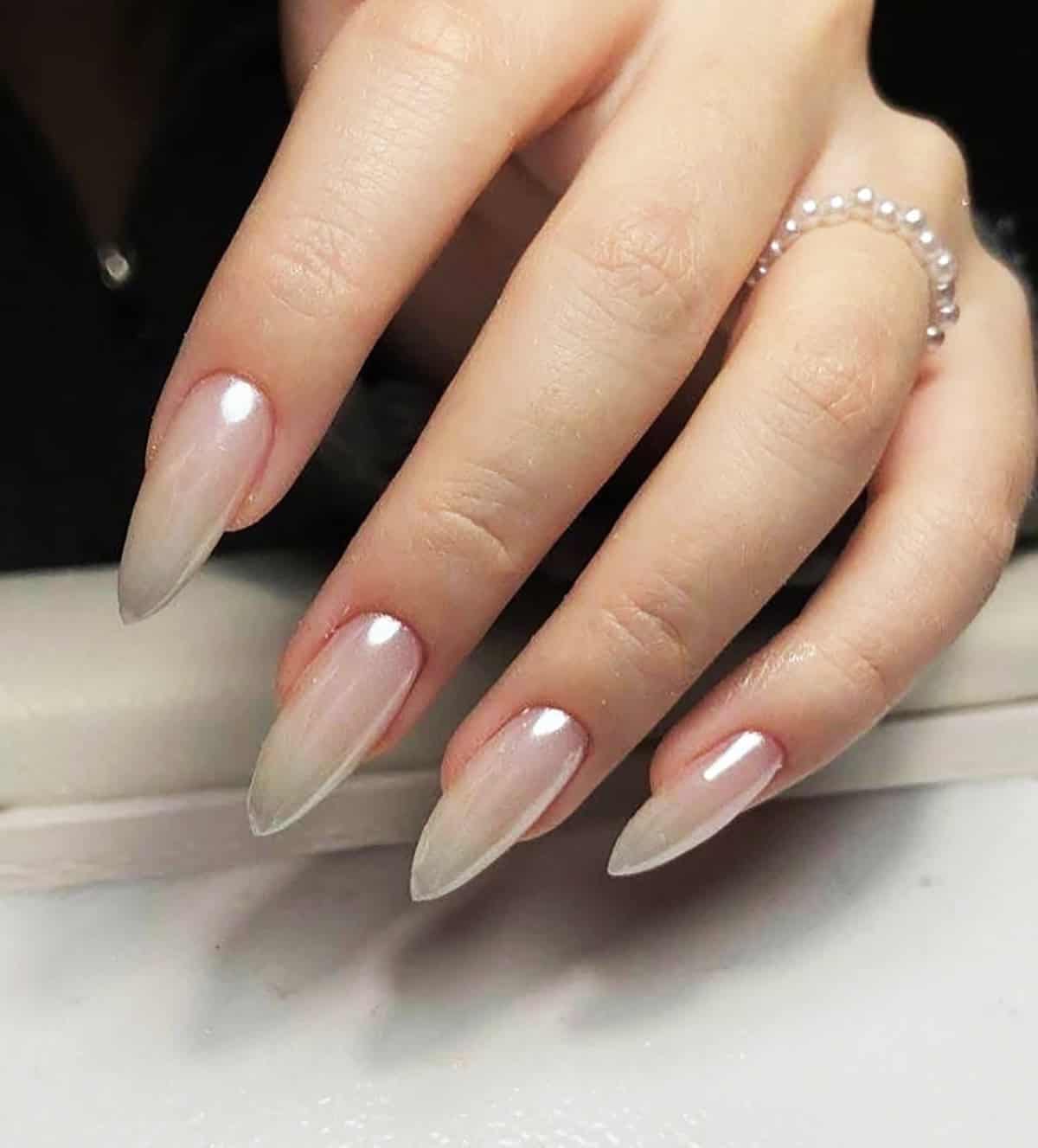 stiletto nails with nude to white ombre chrome finish white chrome nails