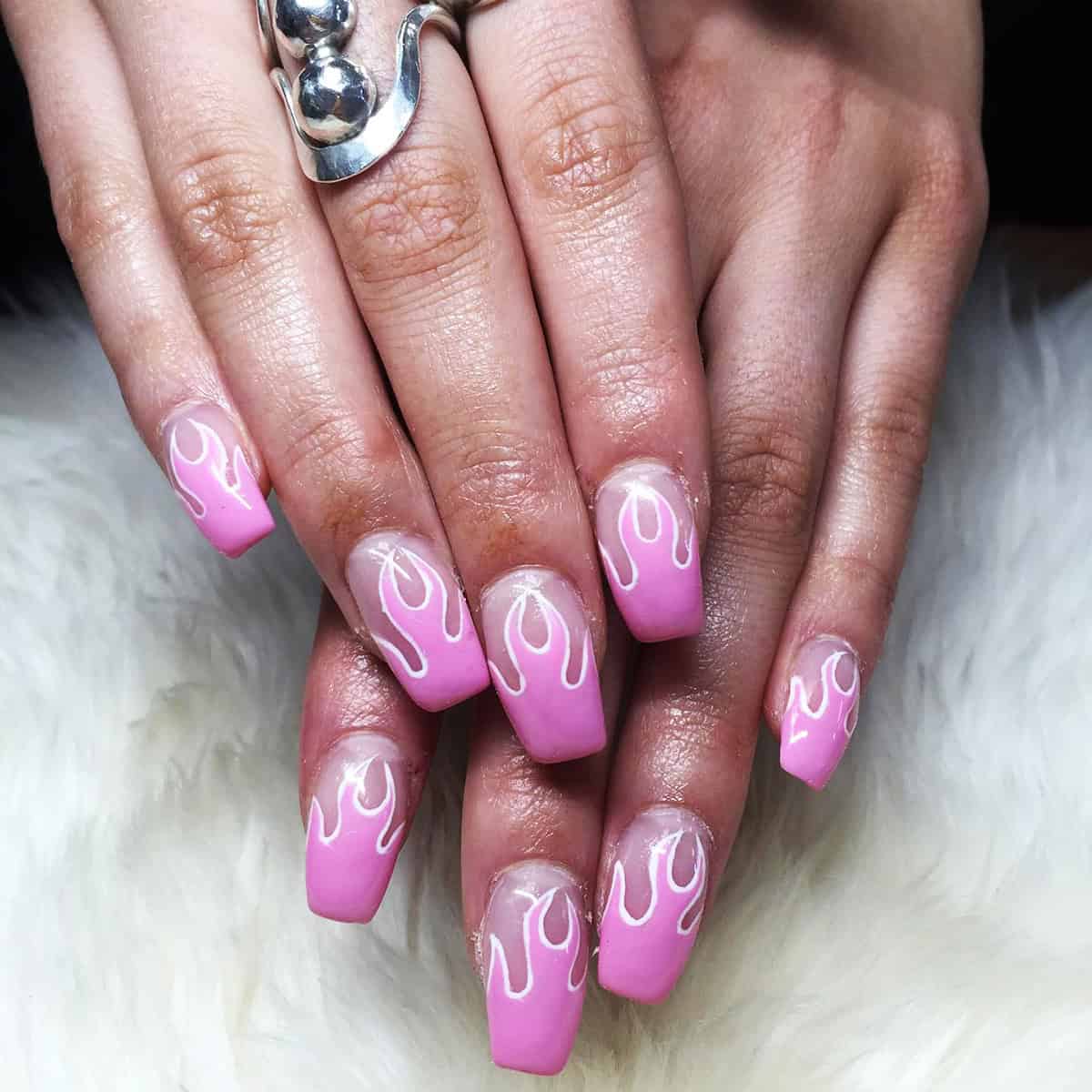 soft pink coffin nails with white flame outlines and sheer nail fade nails arts