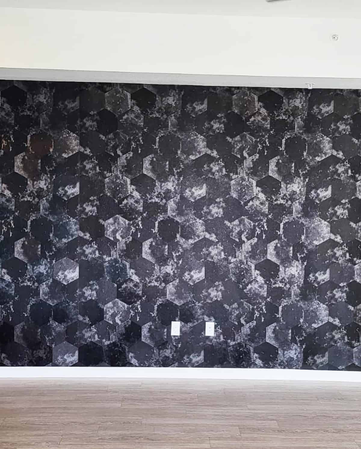 modern living room with black hexagon patterned wall and light wood floors black wallpaper ideas home decor