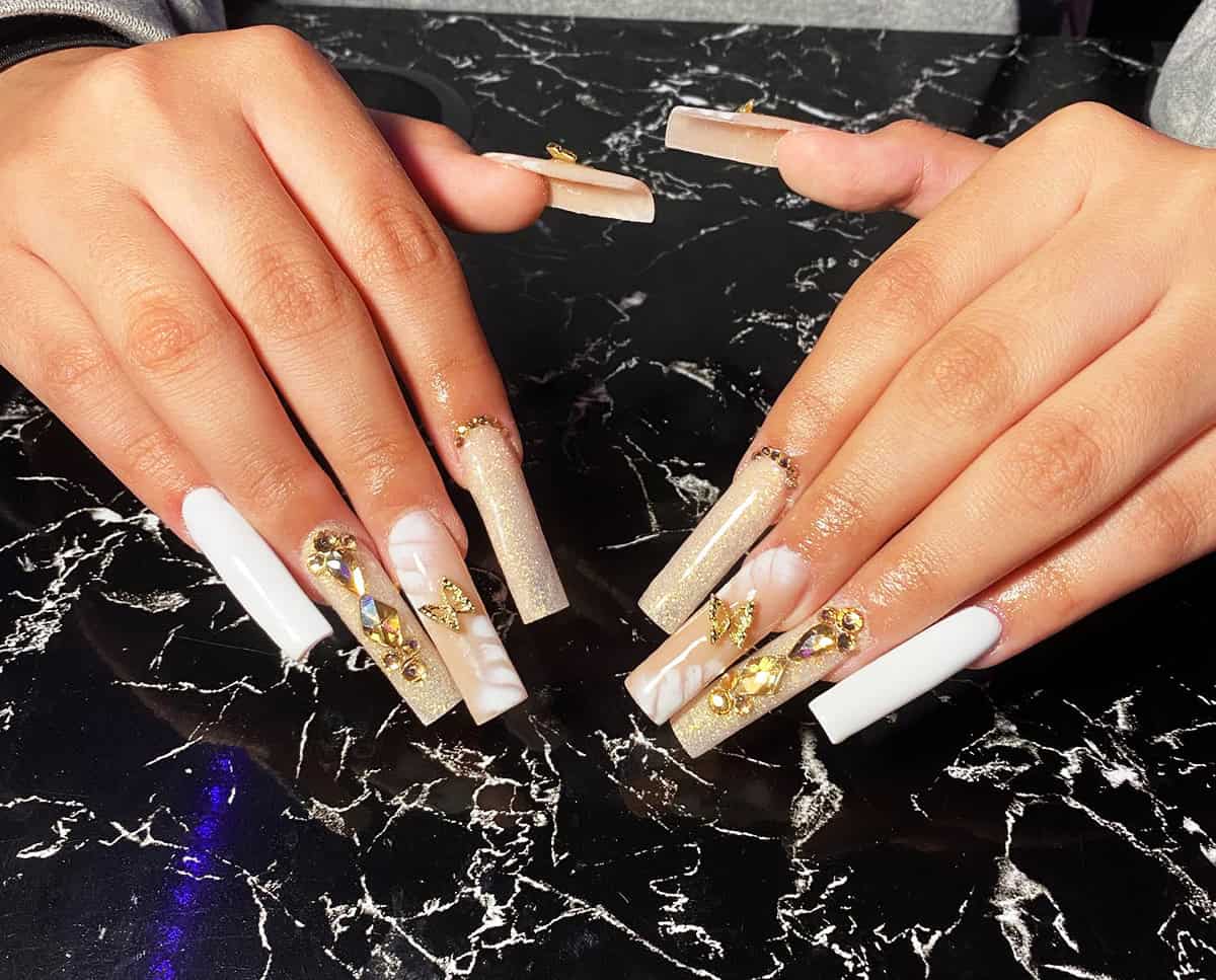 long square white and marble nails with gold details and rhinestones luxury style baddie nails for summer