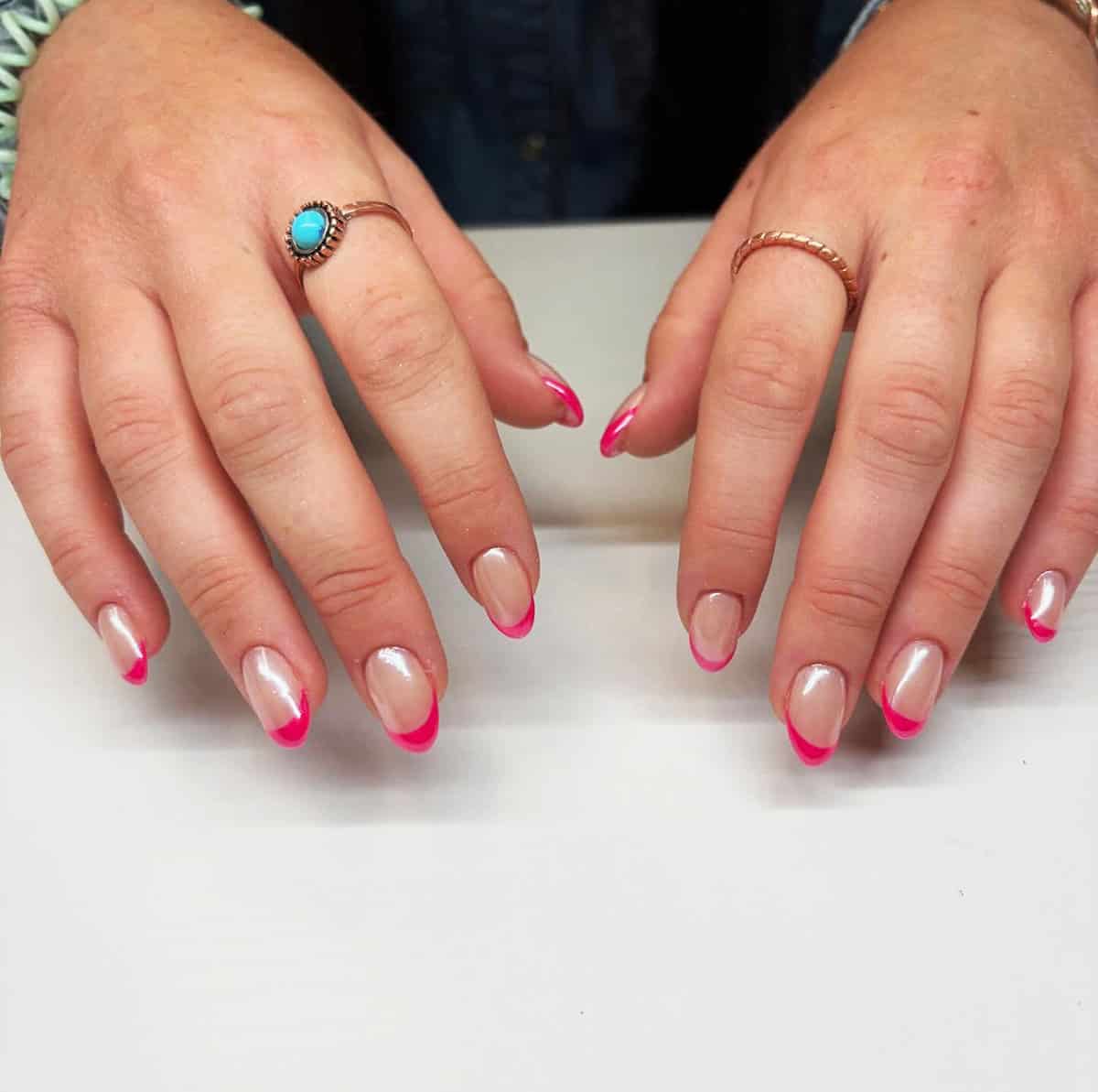 short almond nails with milky pink chrome base and bright pink french tips minimal style pink chrome nails