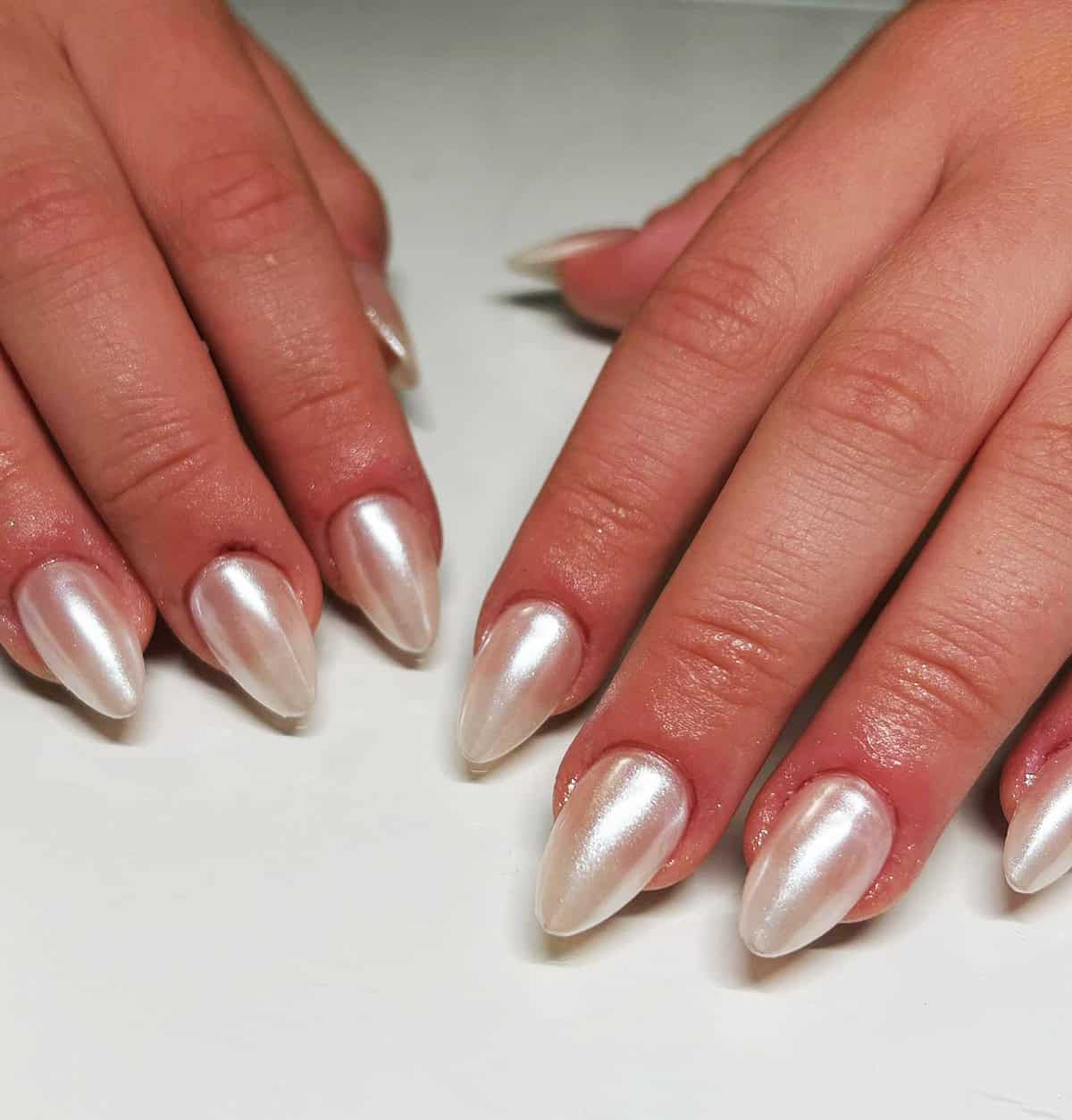 medium almond nails with classic bright pearly white chrome finish white chrome nails