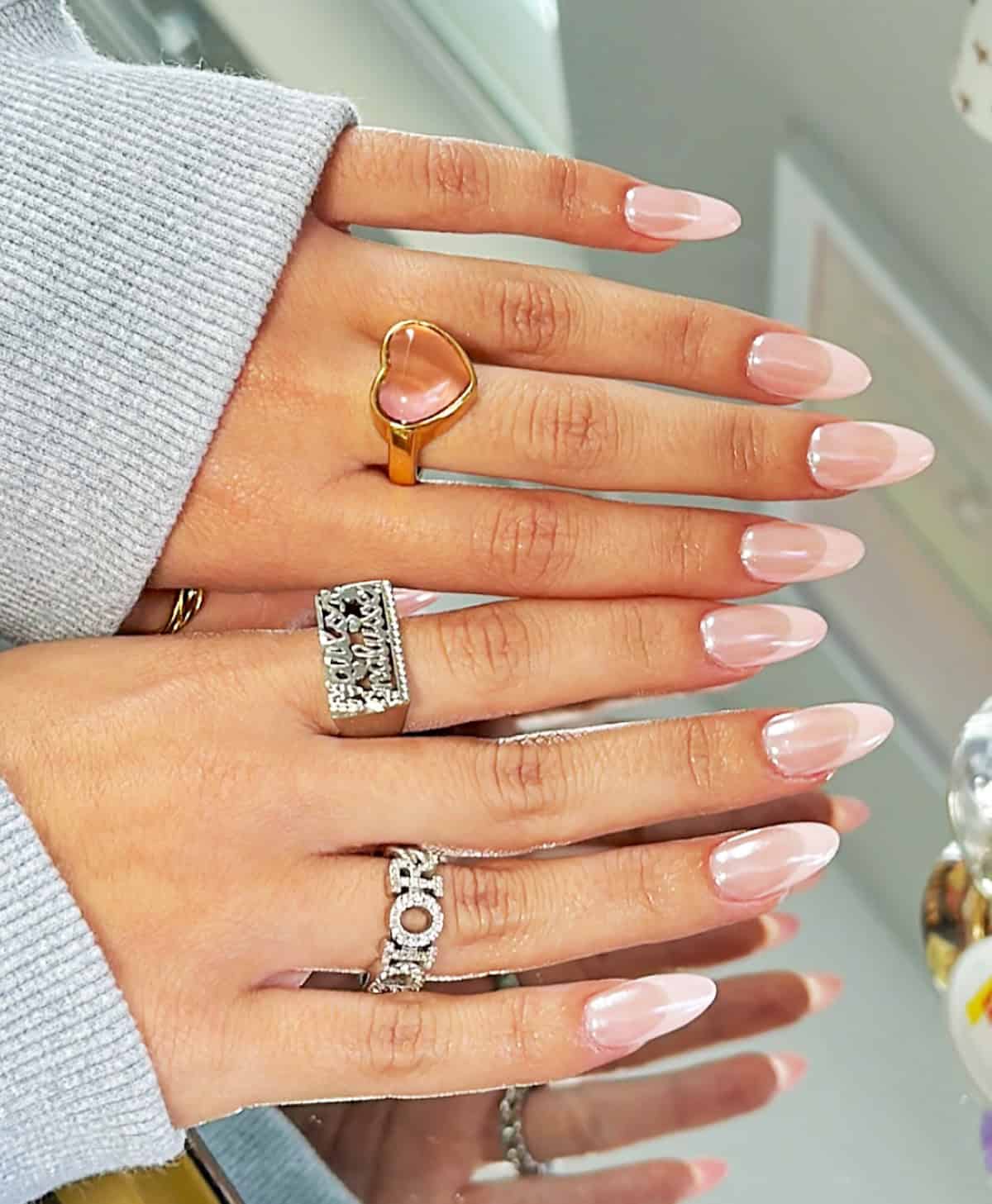 sheer pink chrome almond nails natural glossy finish minimal clean aesthetic pink chrome nails