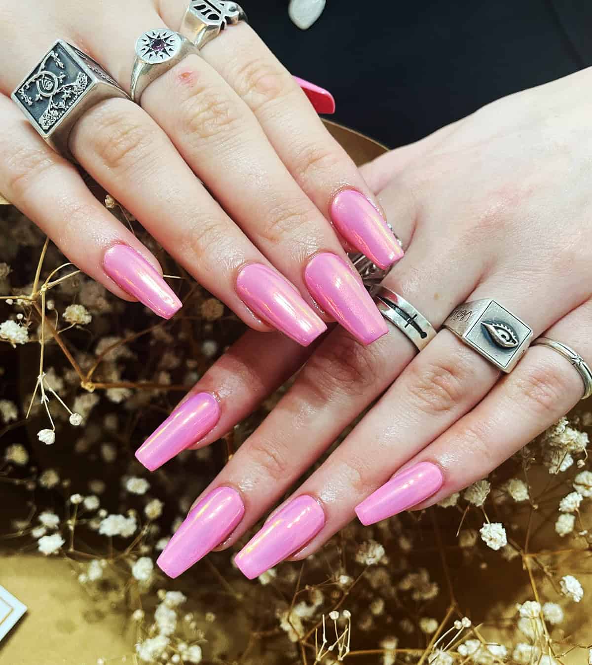 long coffin nails with glazed pink chrome finish soft reflective shine trendy look pink chrome nails