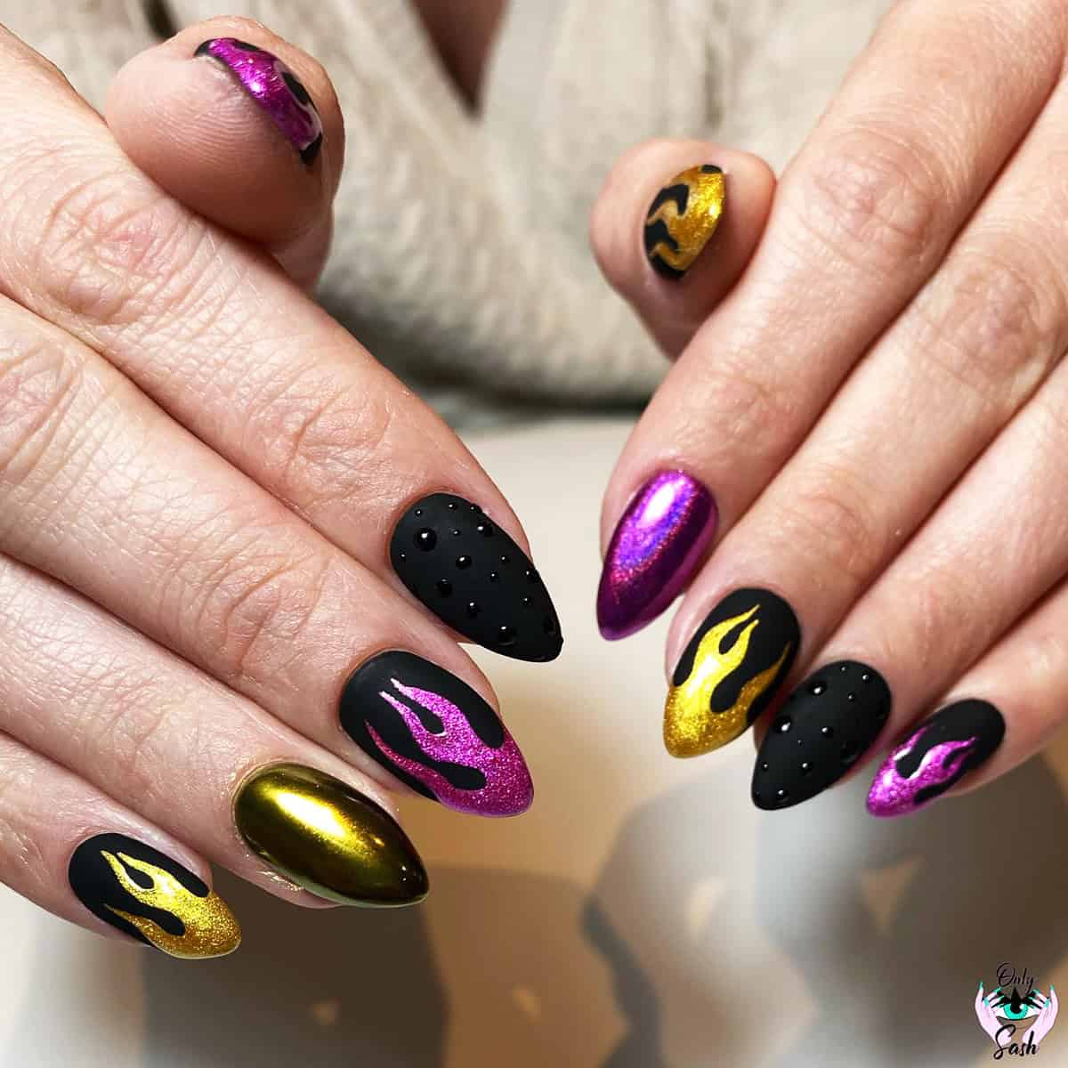 matte black almond nails with chrome gold and magenta metallic flame nail art fire nails
