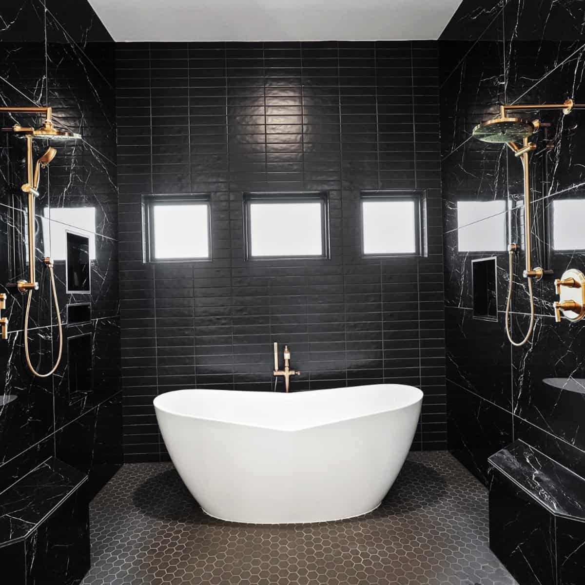 matte black subway tile bathroom with white freestanding tub and brass fixtures black bathroom ideas