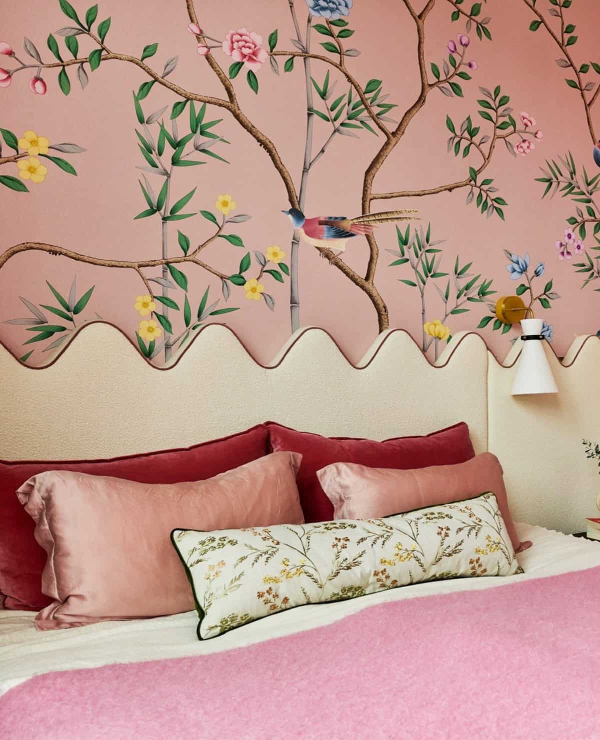 blush pink chinoiserie wallpaper with scalloped headboard and velvet cushions in a feminine bedroom pink wallpaper ideas home decor